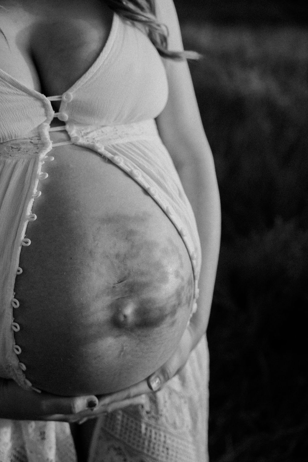 Black and white series showing progression of pregnancy with growing baby bump.