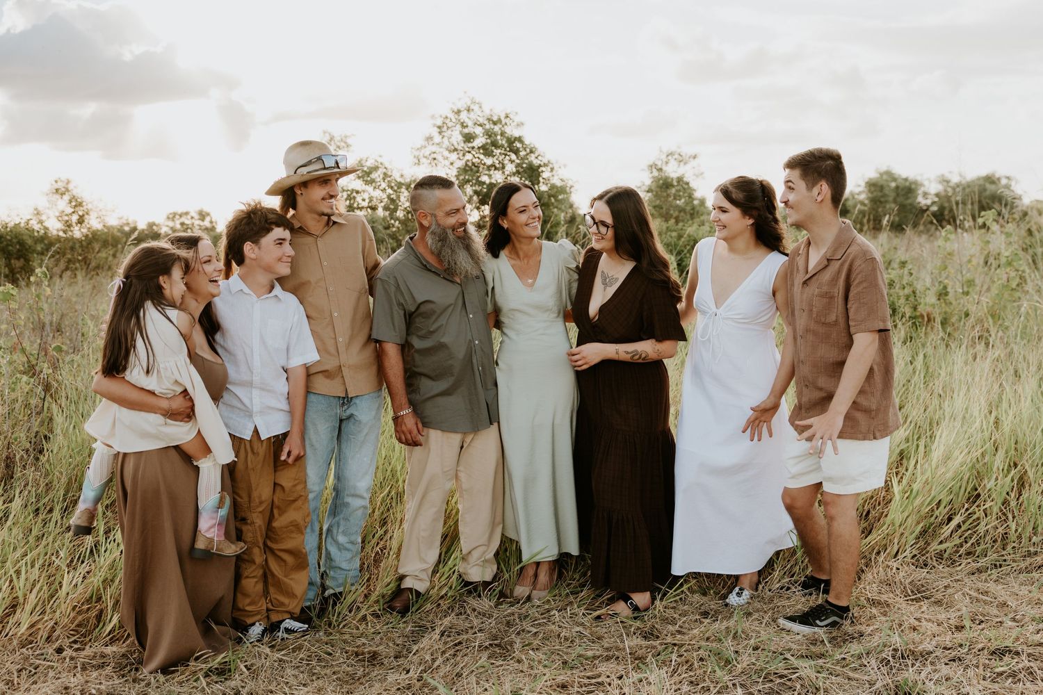 Extended family portrait in neutral tones during outdoor photography session