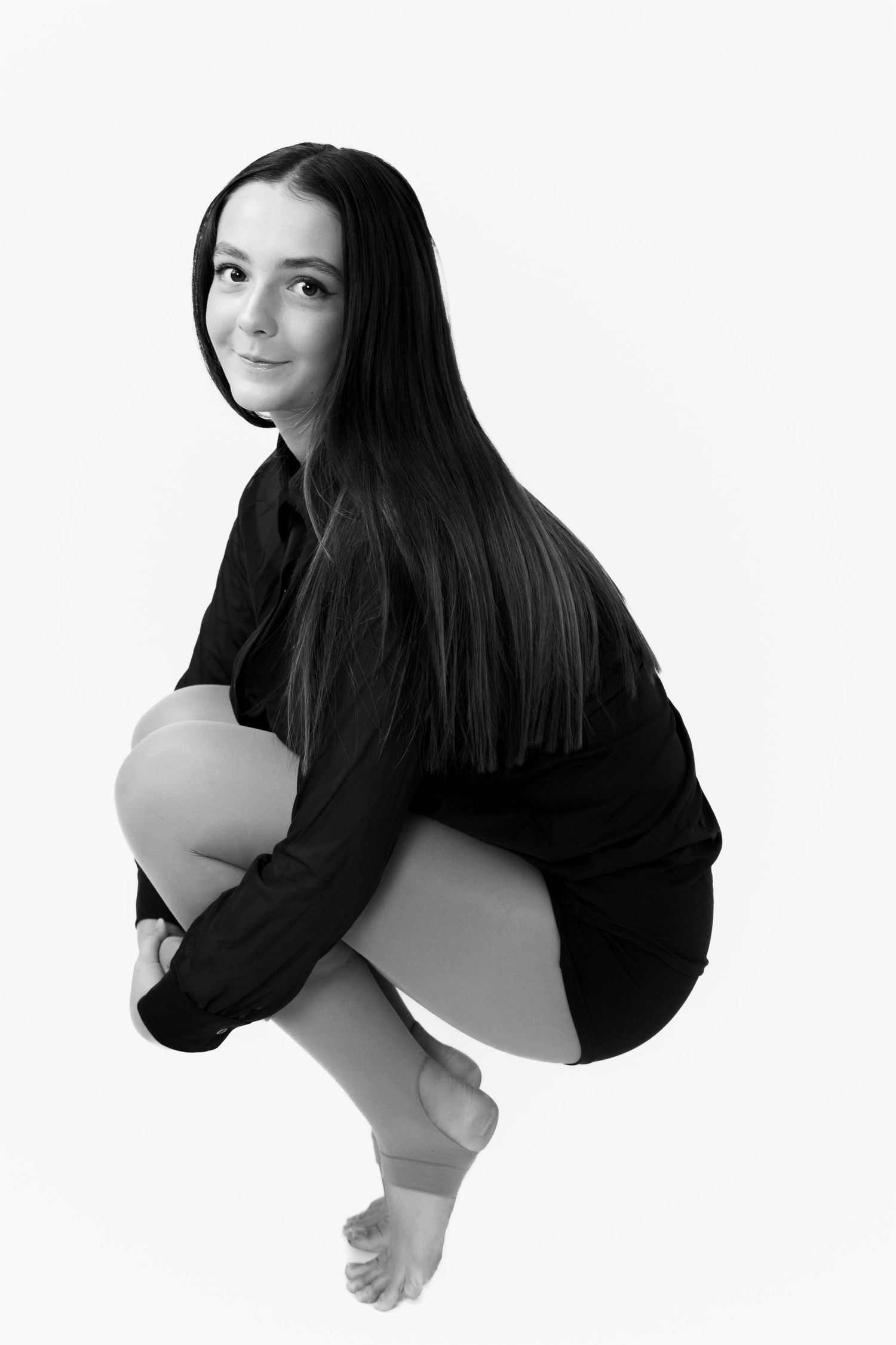 Minimalist black and white portraits showing artistic poses against white background.