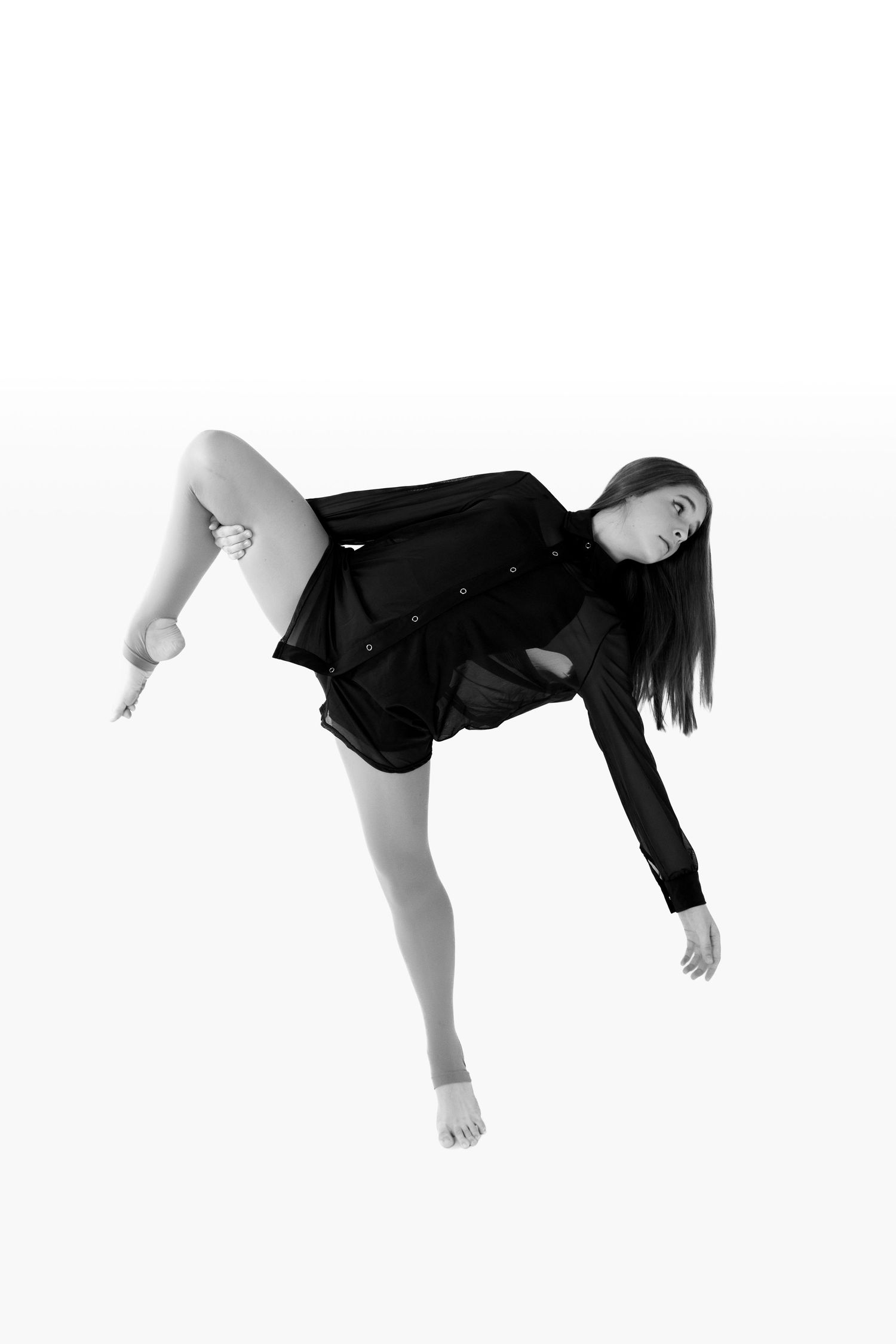 Black and white artistic dance poses captured against a white background.