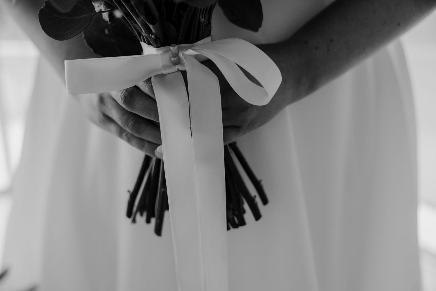 Black and white detail shot of hanging decorative tassels.