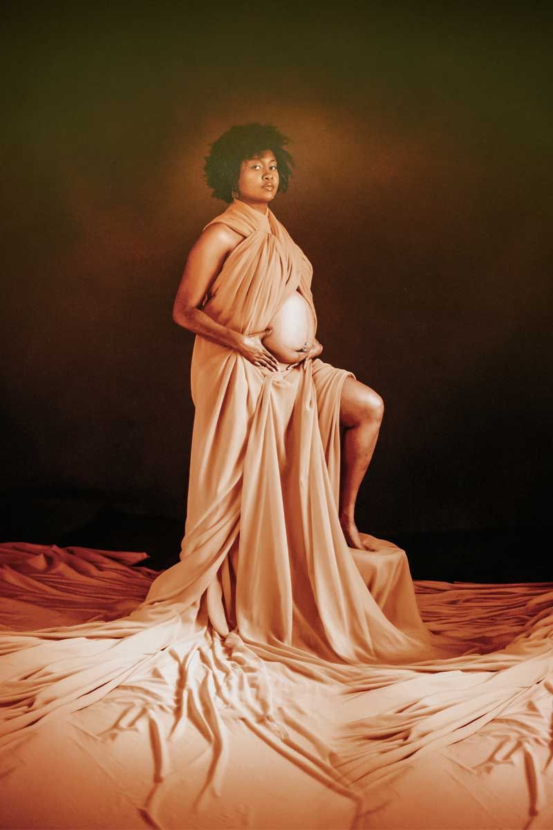 Artistic portraits featuring flowing peach fabric against a dark dramatic background.