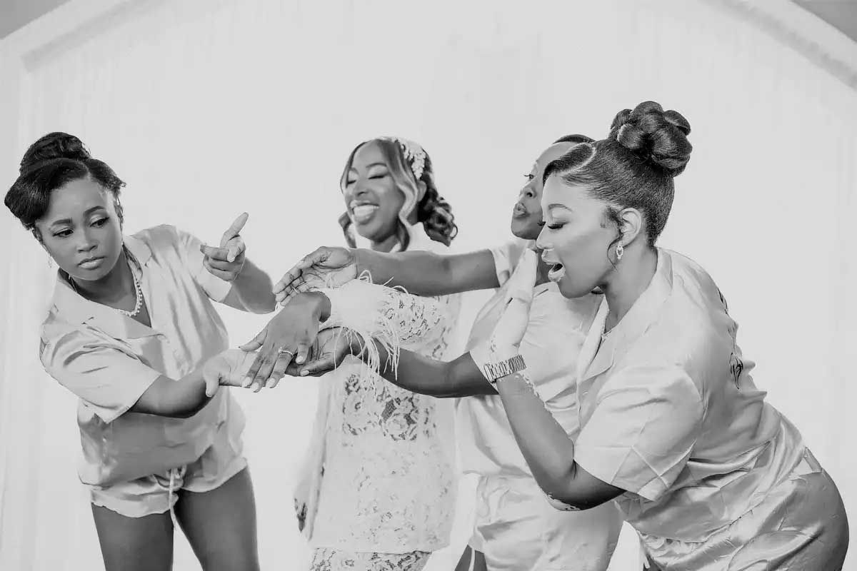 Black and white photo series captures joyful dancing moments at a wedding celebration.