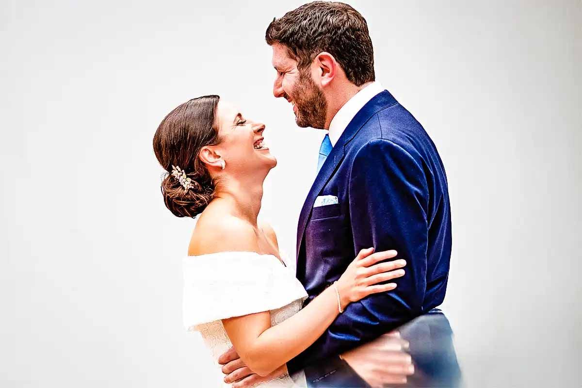 Romantic wedding portrait series with couple in formal attire against white background.