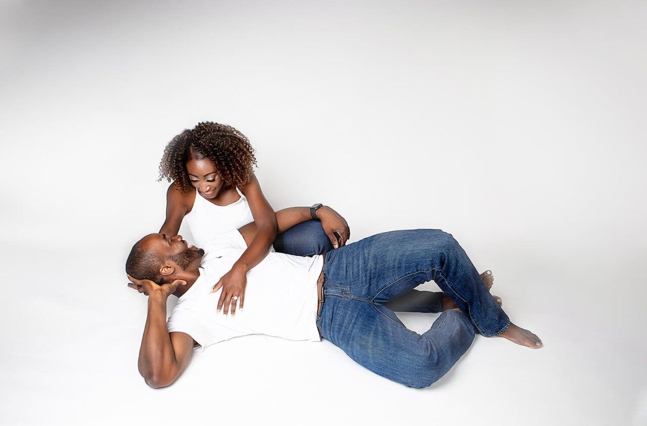 Creative angles capture couple's connection during studio photography session.