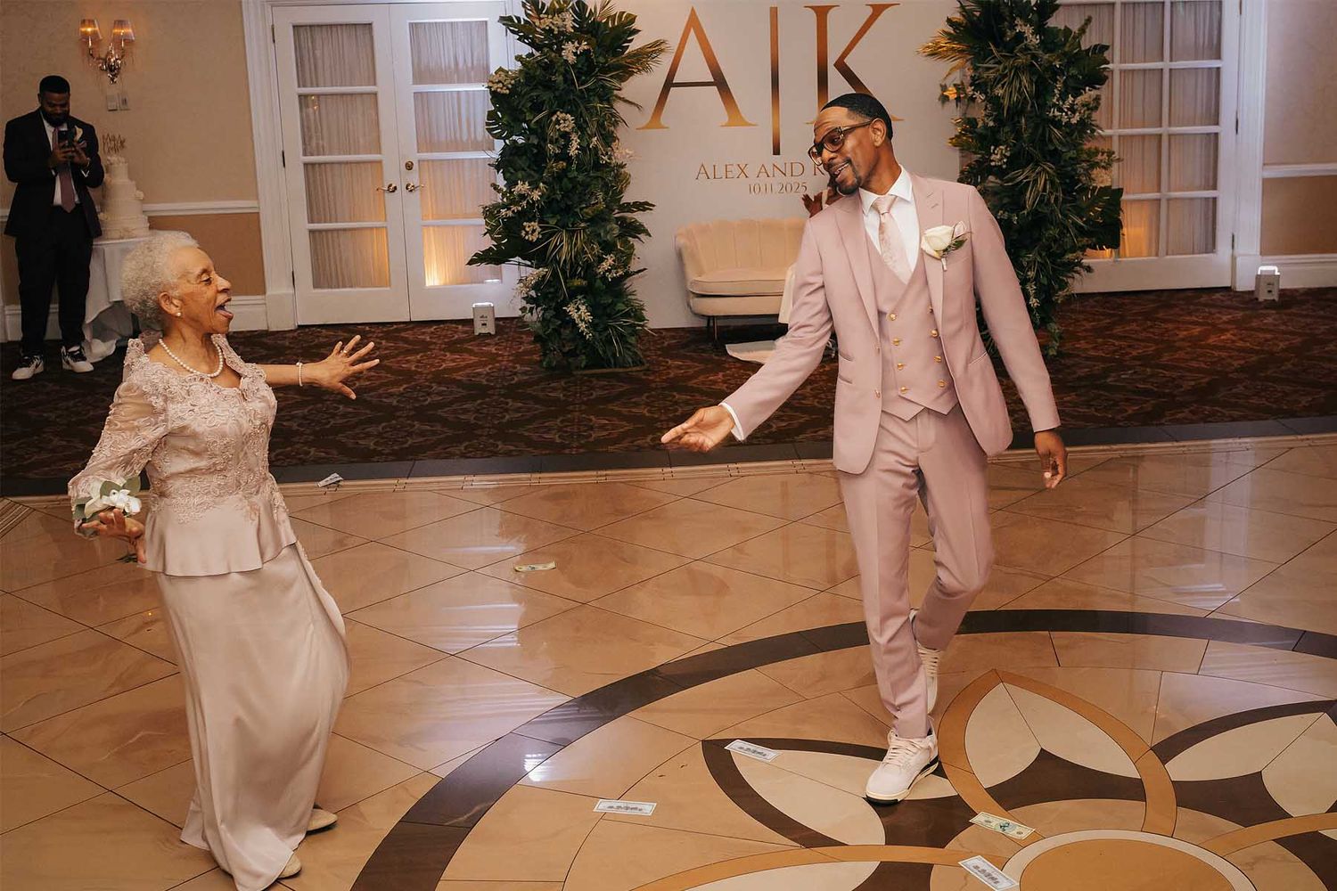 Wedding reception venue with elegant lighting and decorative elements.