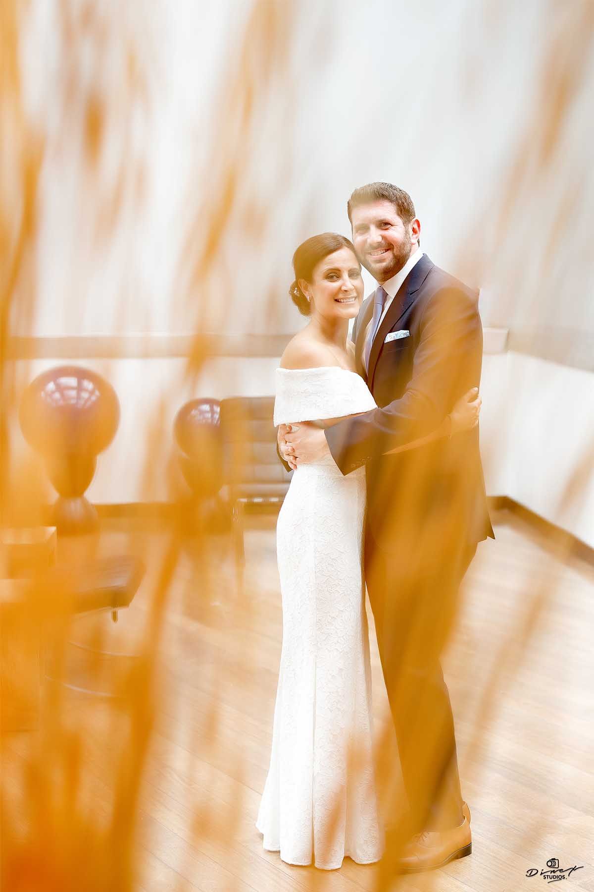Artistic motion blur wedding photos showing couple dancing in warm golden light.