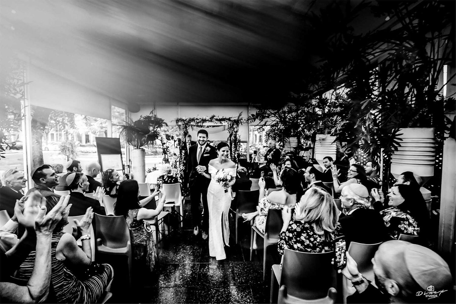Black and white photos of wedding reception guests dancing and celebrating.