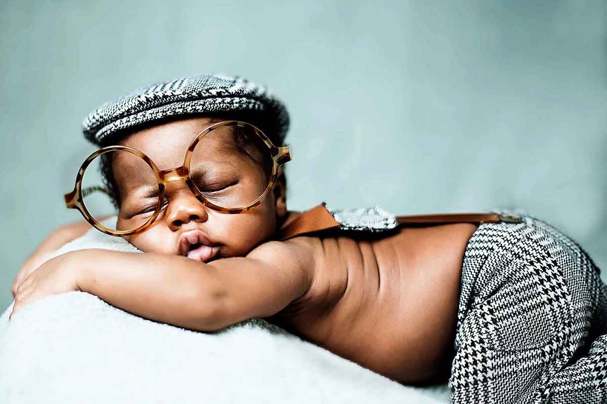 A series of intimate sleeping portraits against a soft blue background.