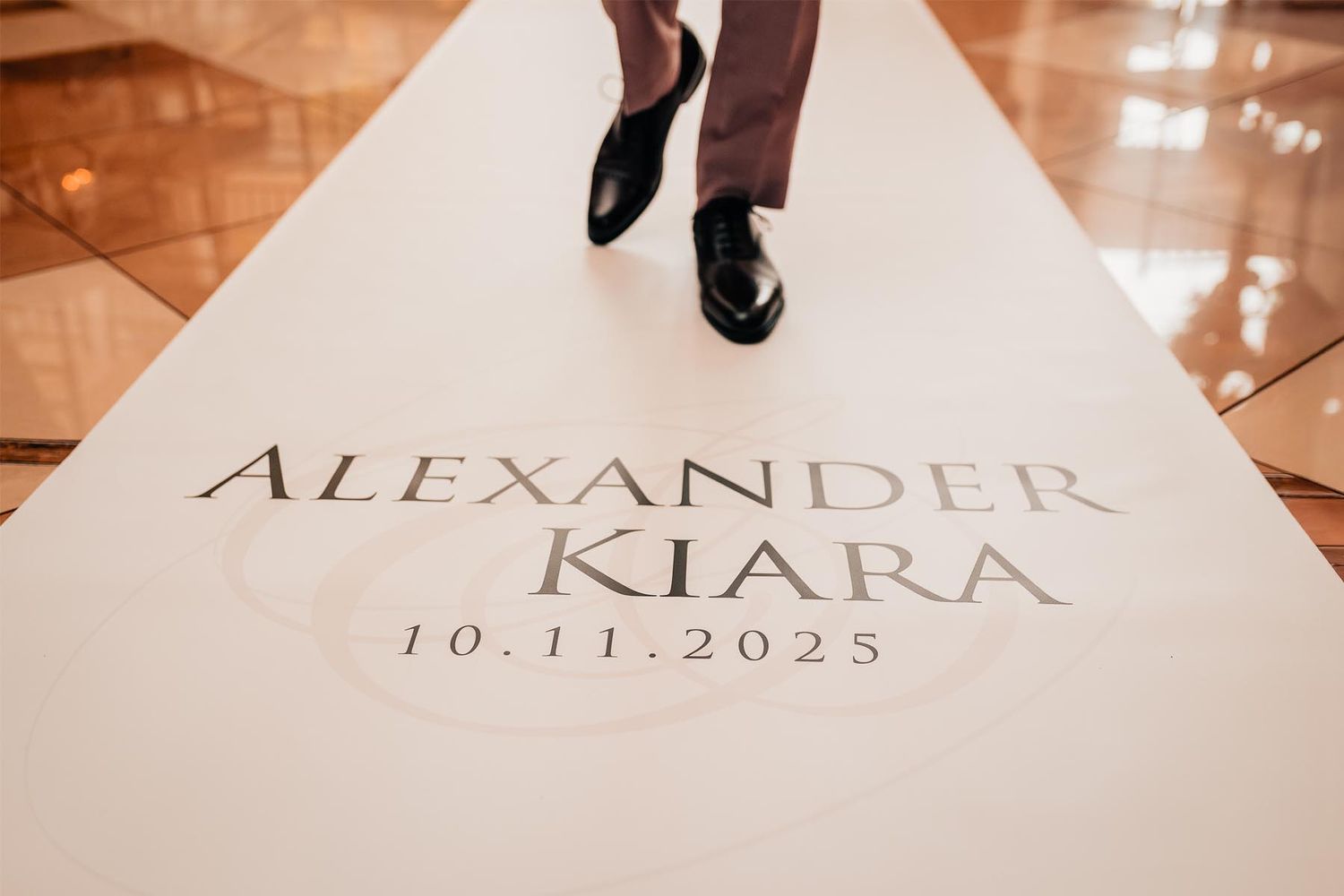 Wedding date and names displayed in elegant typography on white paper.