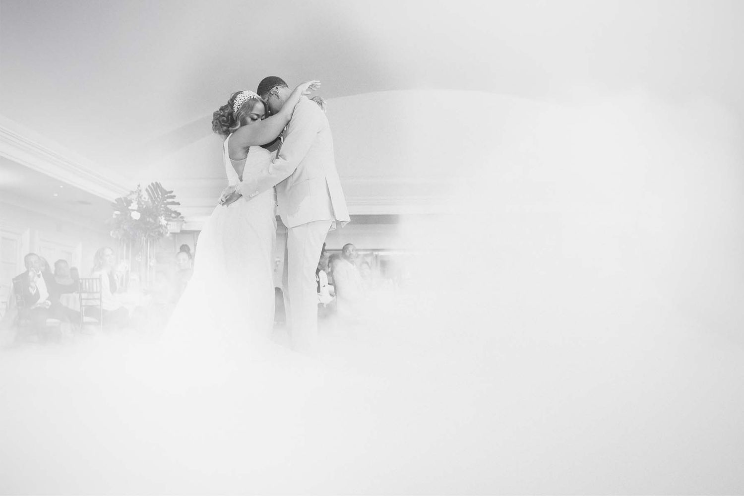Ethereal black and white wedding dance floor moments captured in motion.
