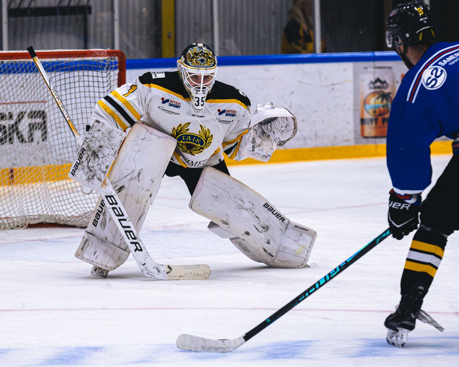 Hockey goalie defends the net during an intense game sequence.