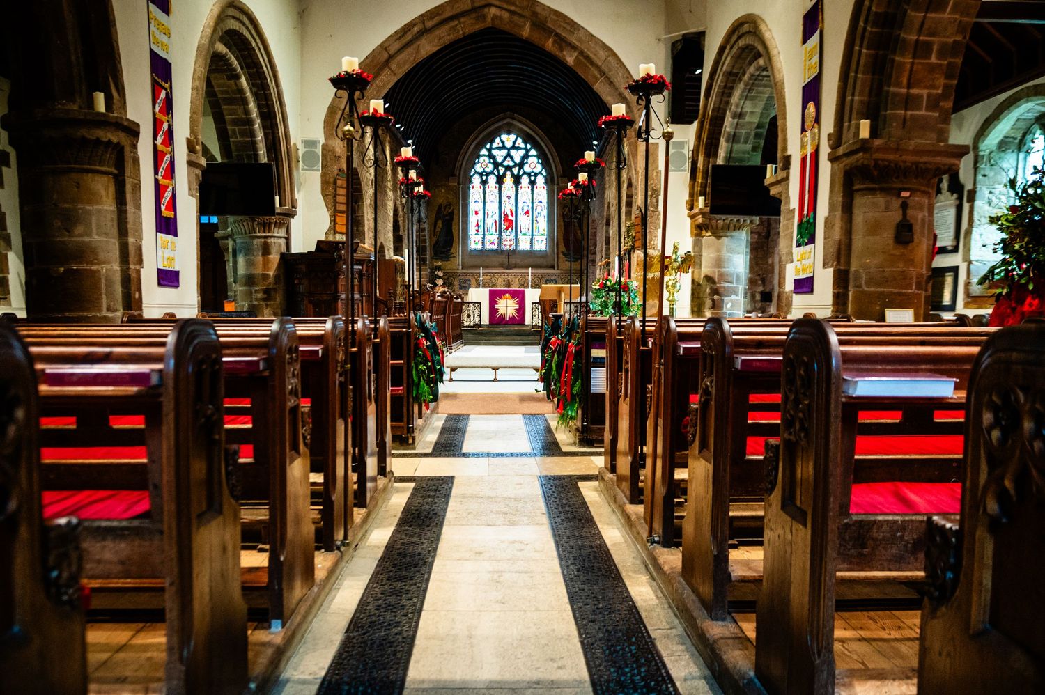 Exterior view of Canford Magna Parish Church, Wimborne, during a summer wedding by Martin Carter Photography