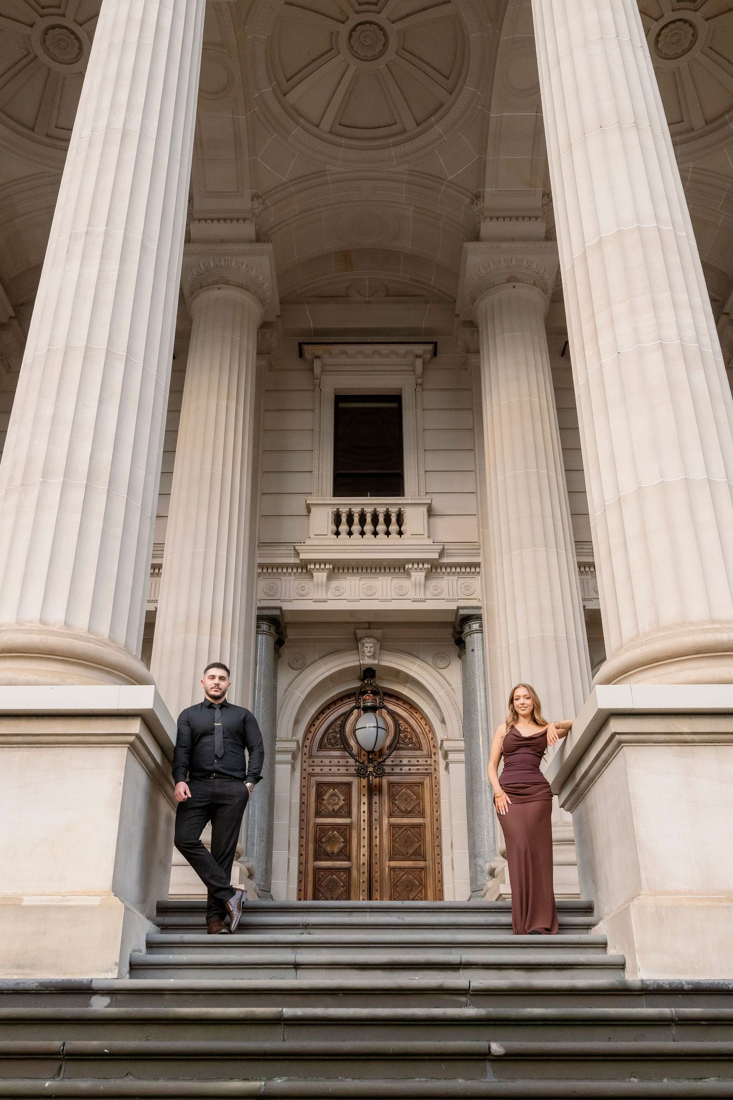Editorial-style engagement portraits outside Parliament House in Melbourne.