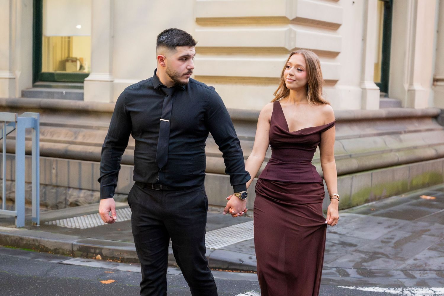 Engagement portraits in Melbourne's CBD with historic architecture.