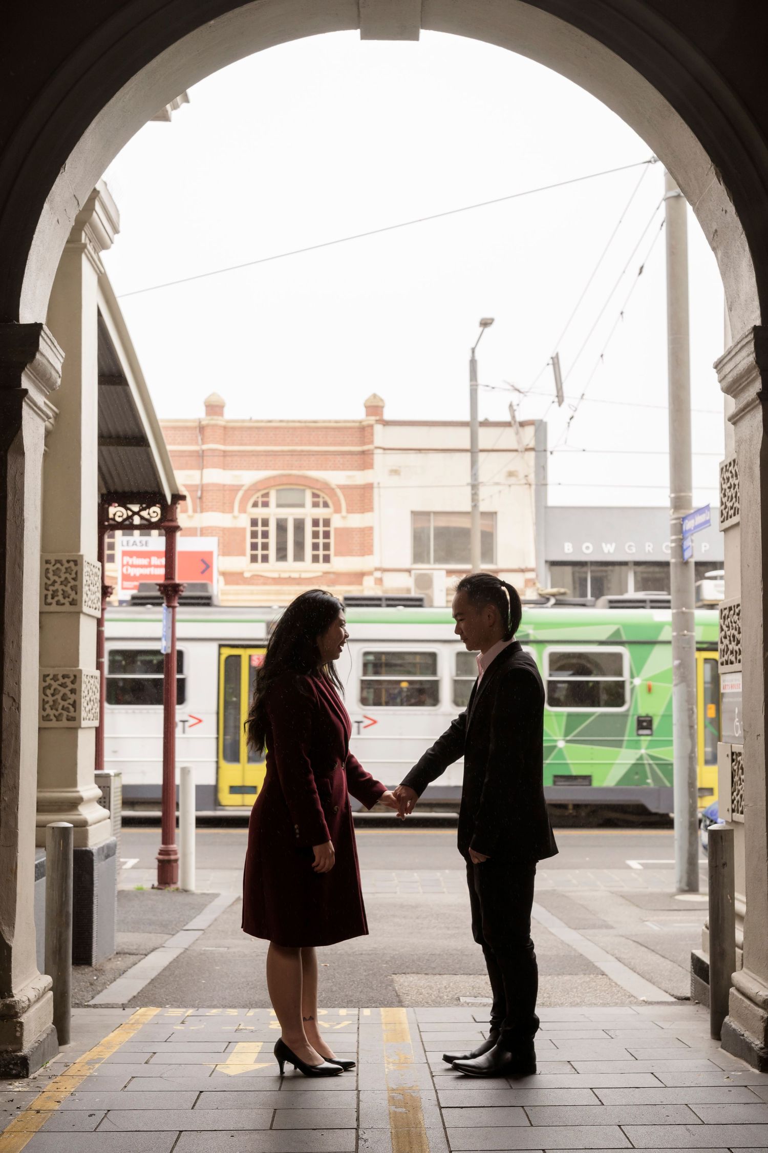 Couple wandering through the streets of Fitzroy during their Melbourne engagement session.