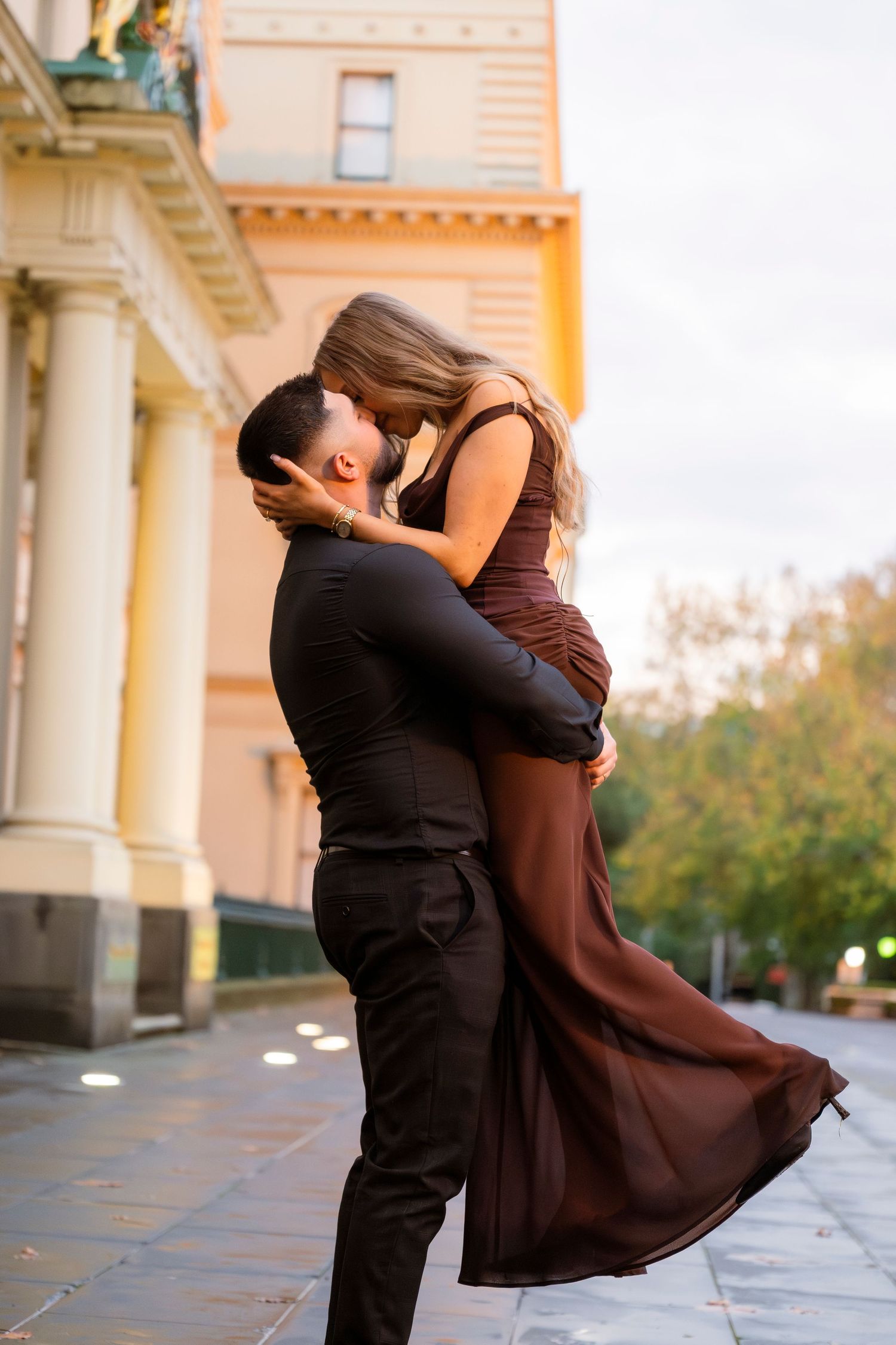 Engagement portraits in Melbourne's CBD with historic architecture.
