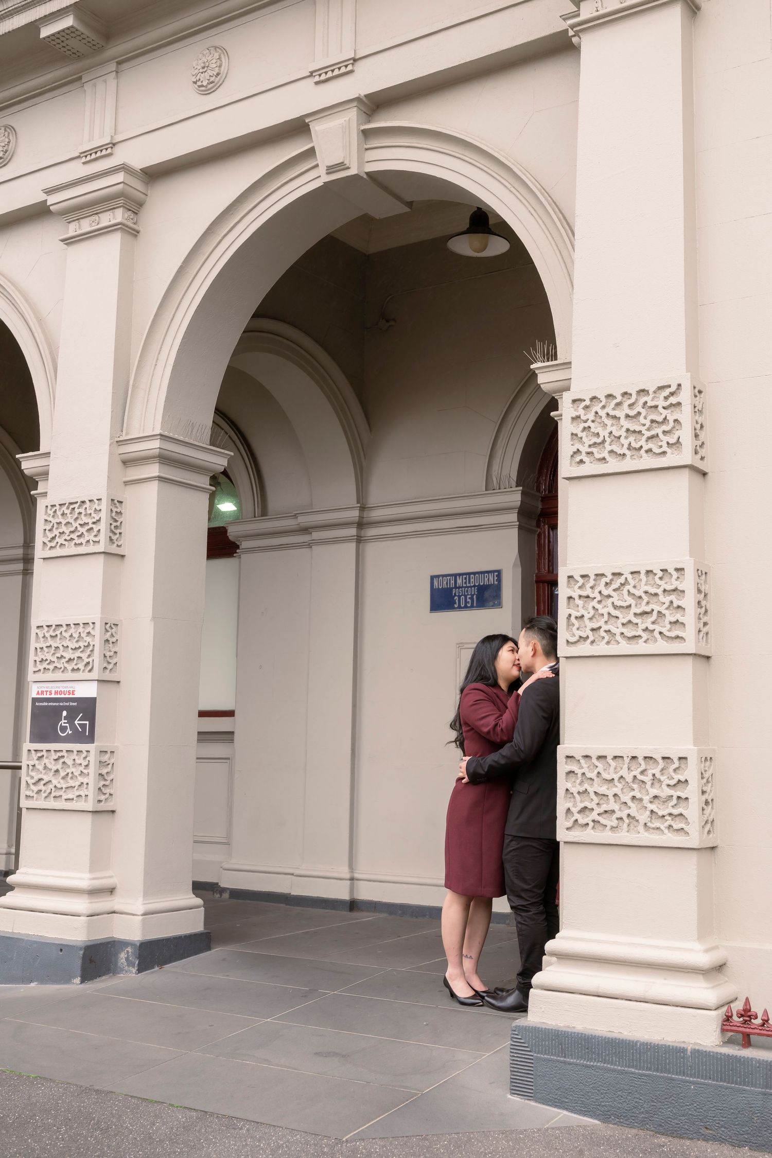 Couple wandering through the streets of Fitzroy during their Melbourne engagement session.
