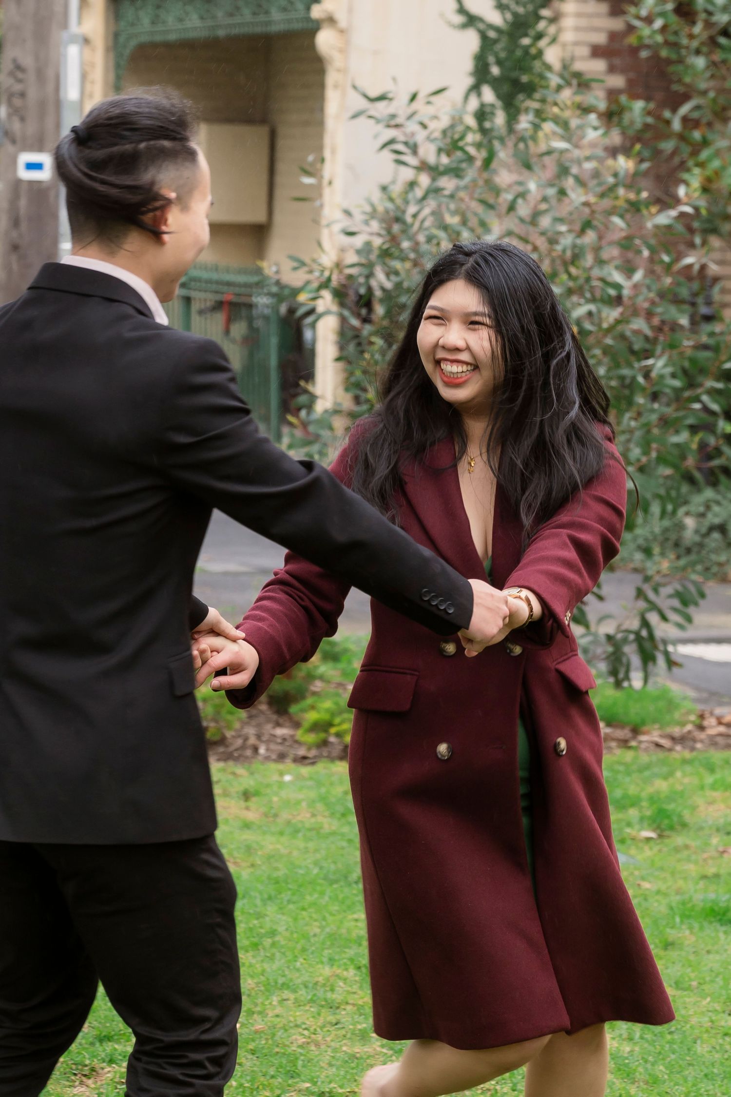 Couple wandering through the streets of Fitzroy during their Melbourne engagement session.