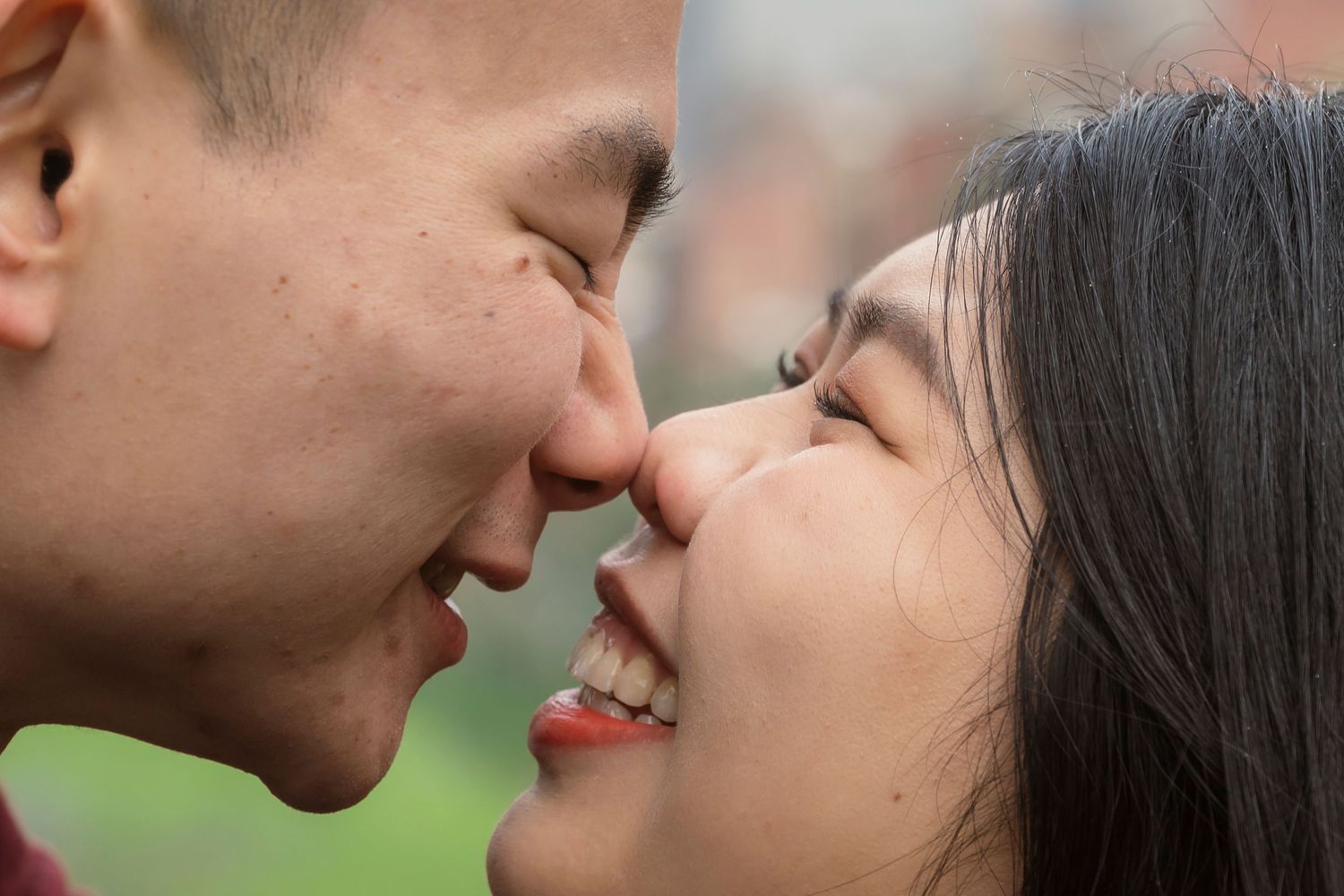 Couple wandering through the streets of Fitzroy during their Melbourne engagement session.
