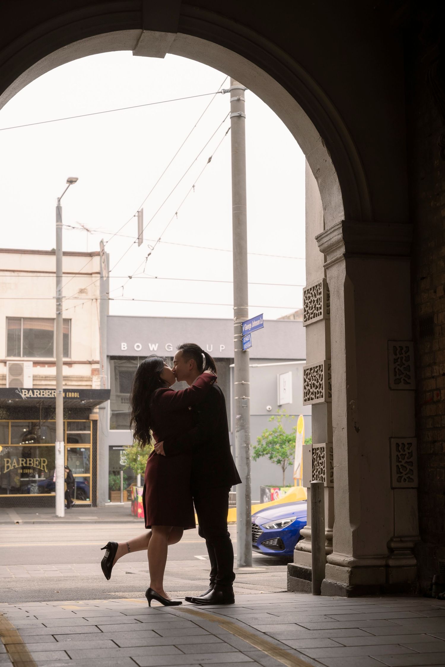 Couple wandering through the streets of Fitzroy during their Melbourne engagement session.