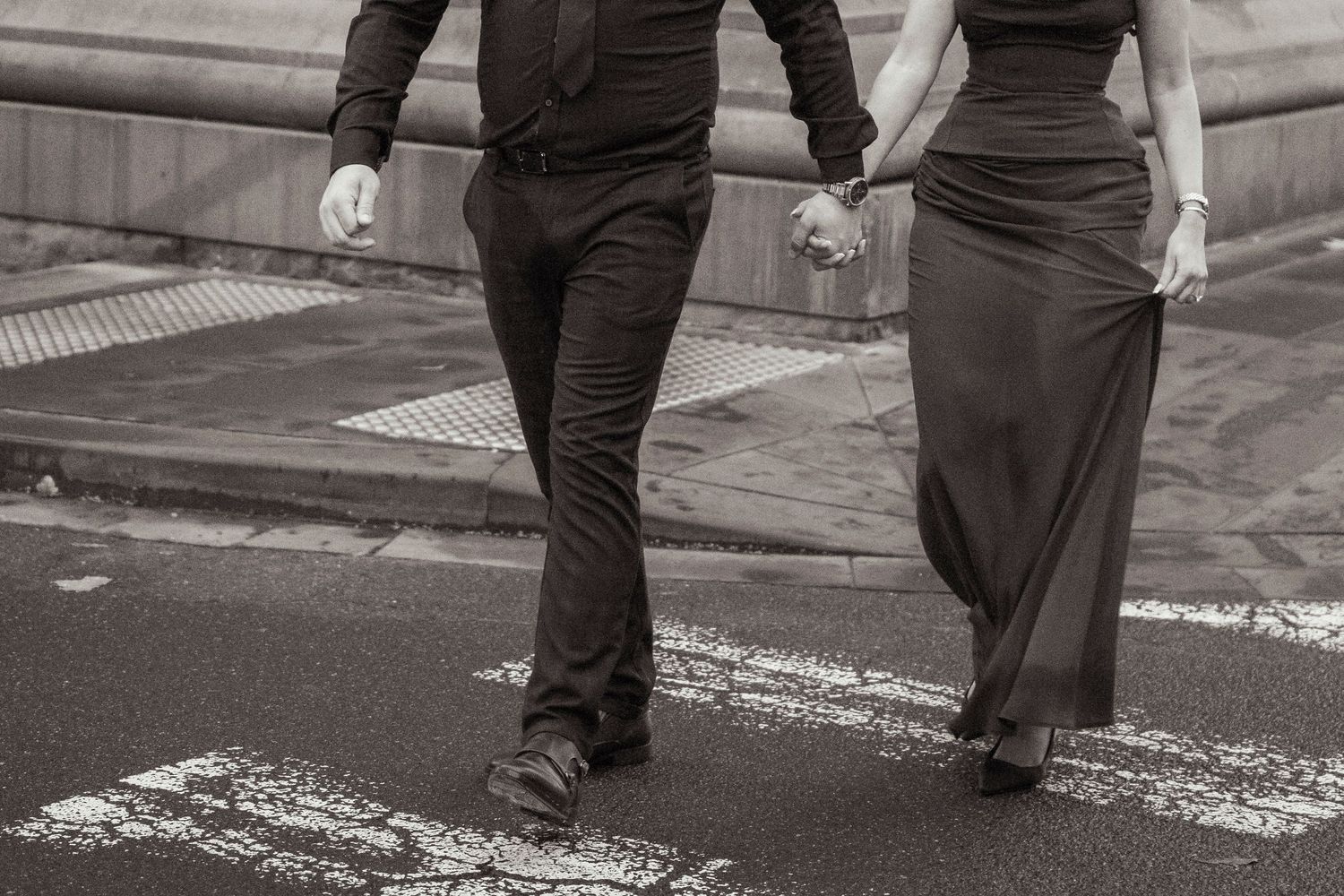 Couple wandering through Melbourne's city streets during their engagement session.