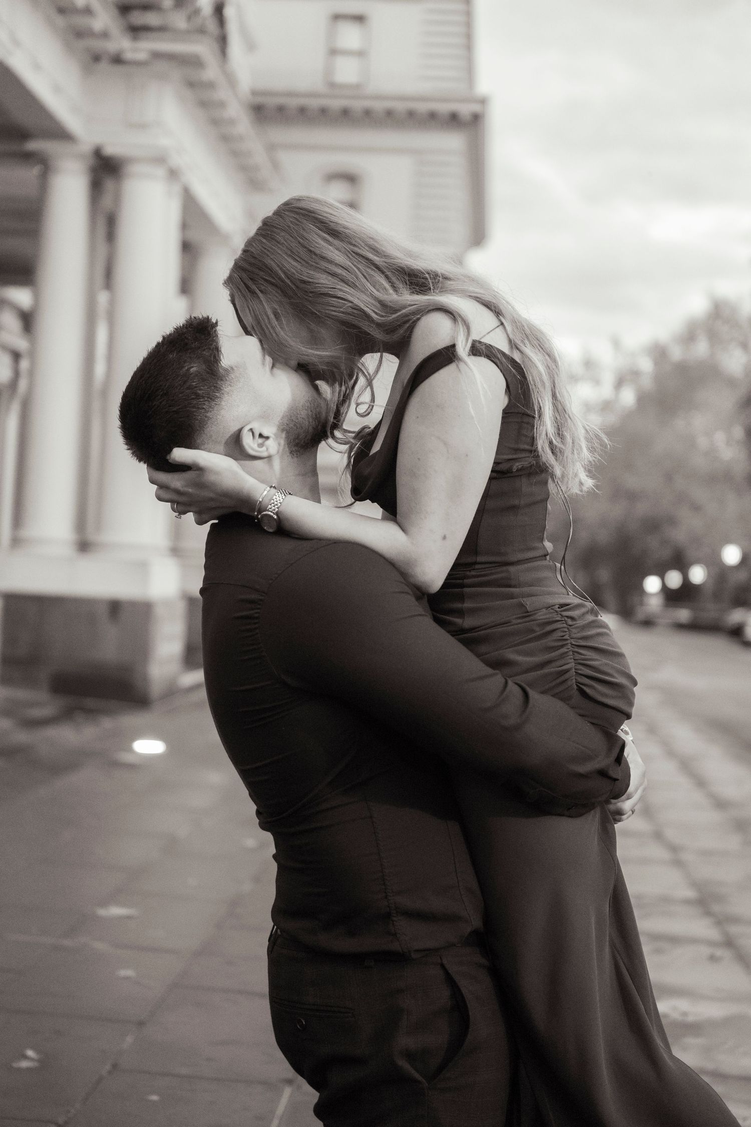 Engagement portraits in Melbourne's CBD with historic architecture.