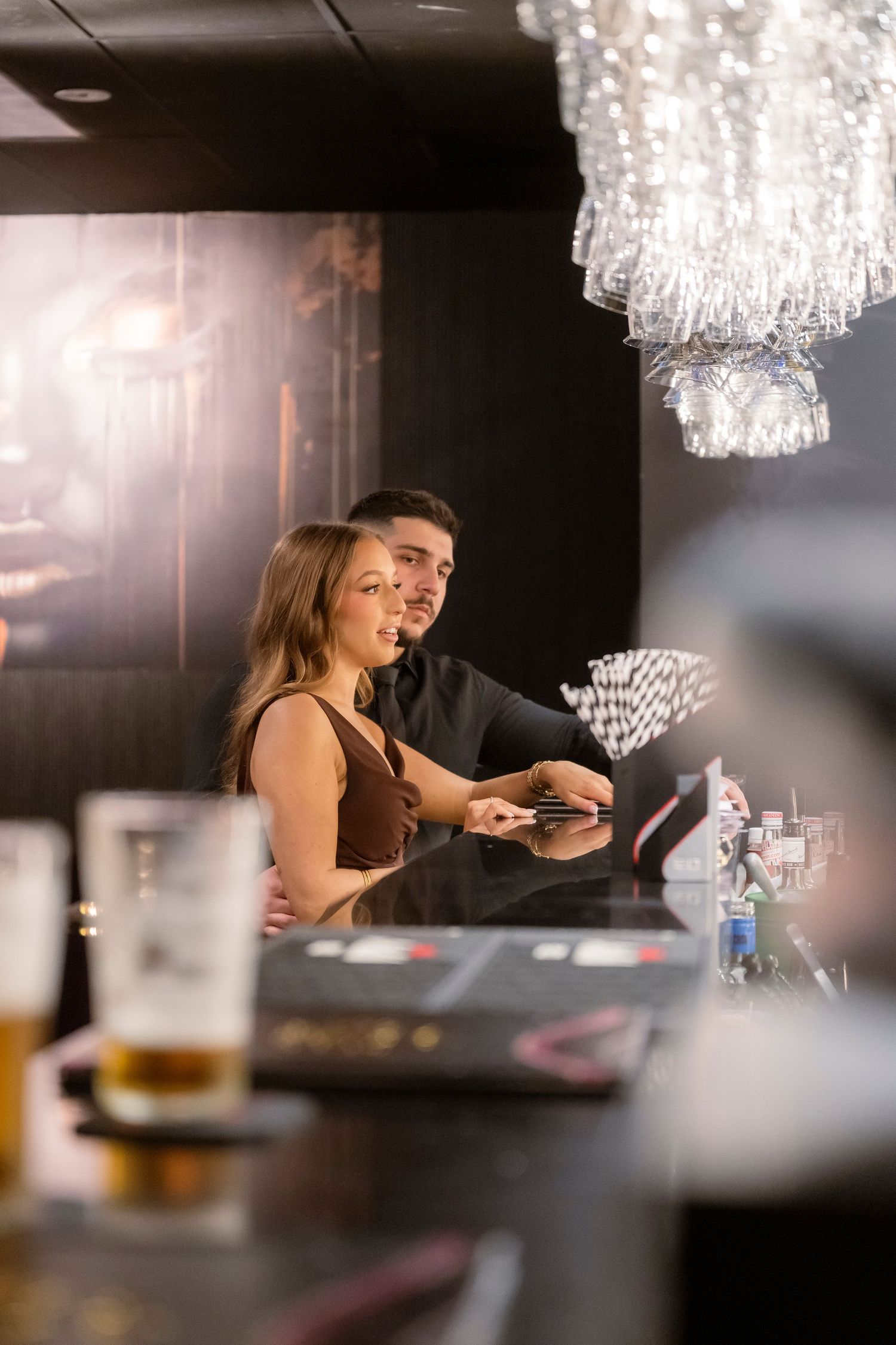 Intimate engagement portraits in a cosy Melbourne city bar.