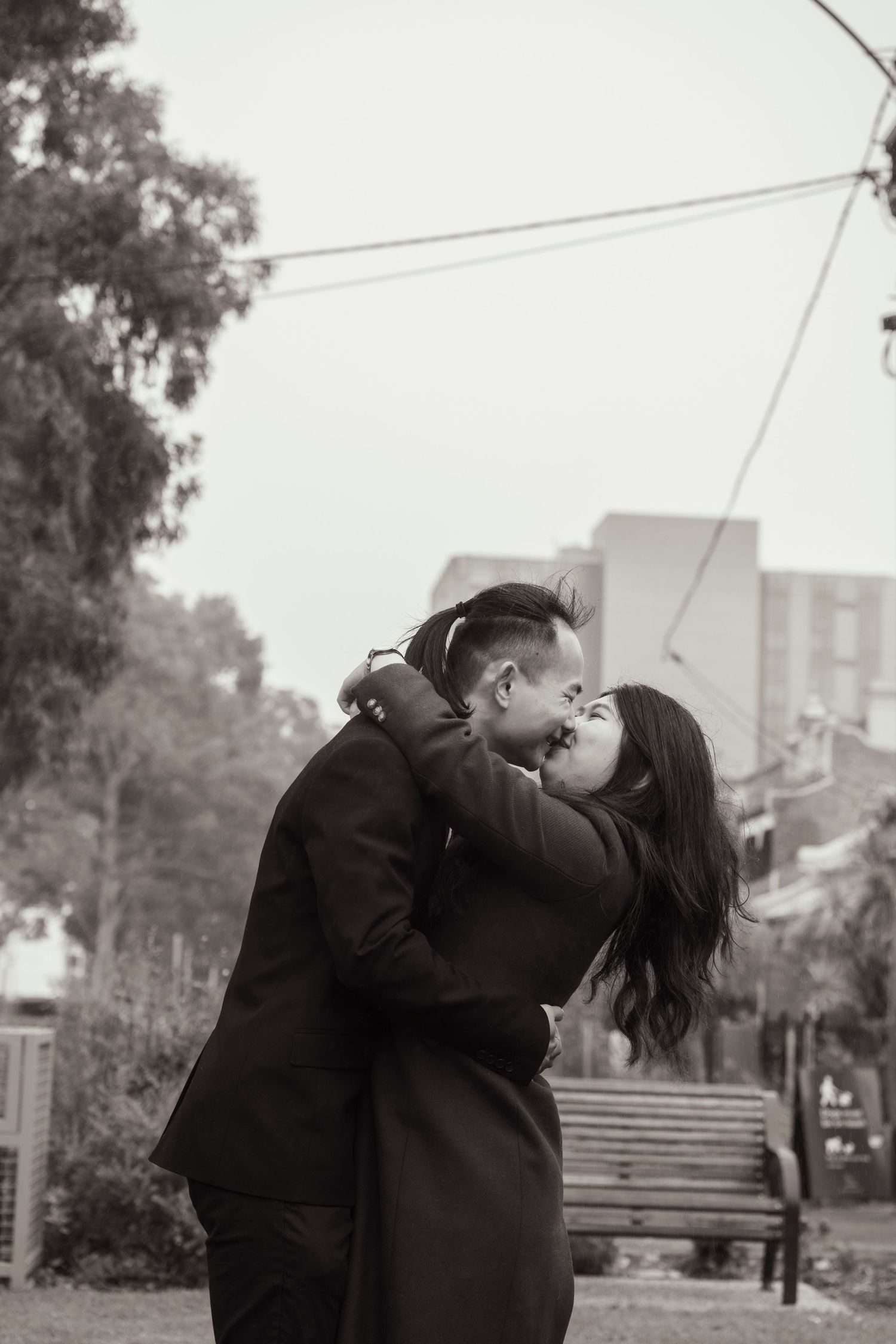 Couple wandering through the streets of Fitzroy during their Melbourne engagement session.