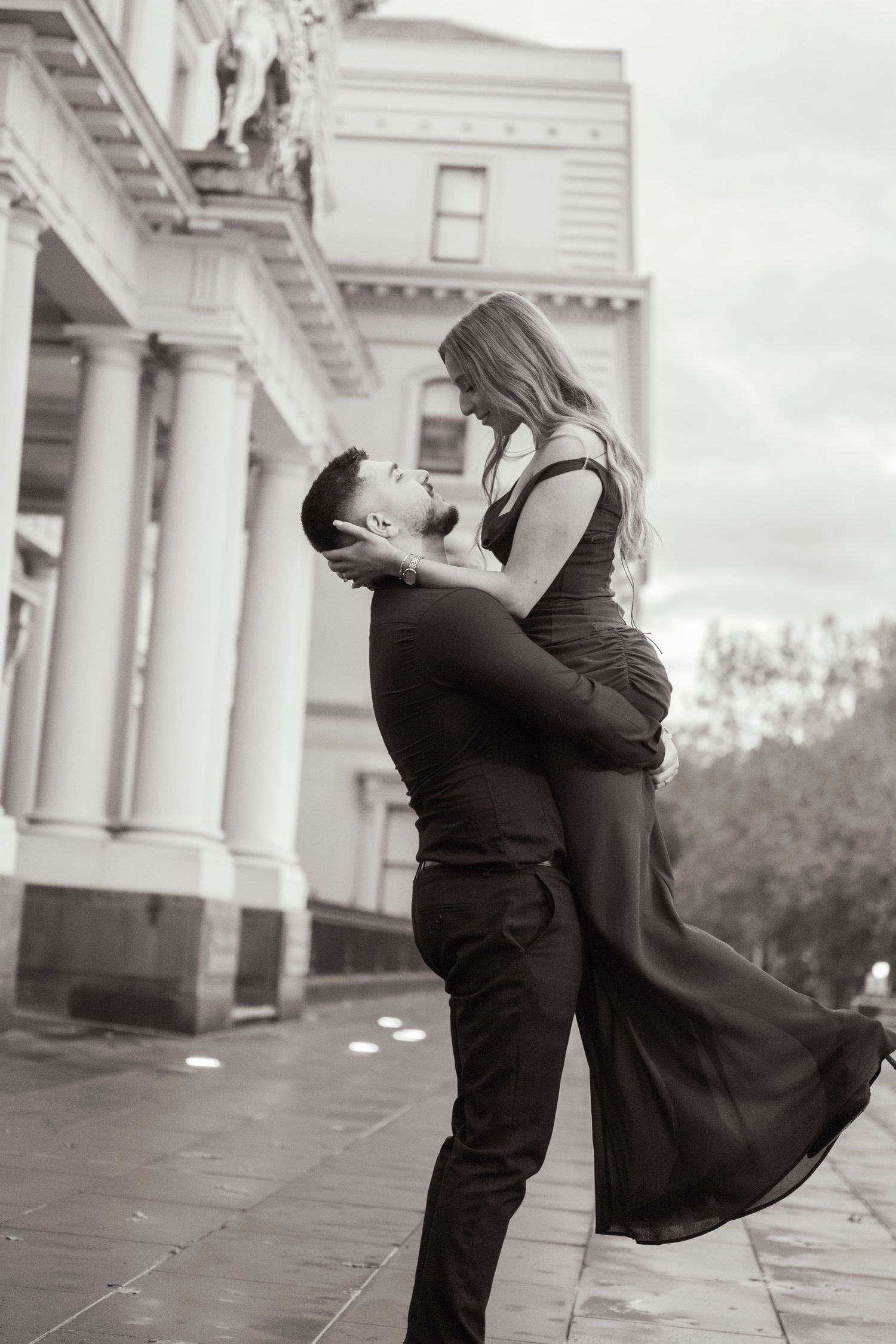 Engagement portraits in Melbourne's CBD with historic architecture.