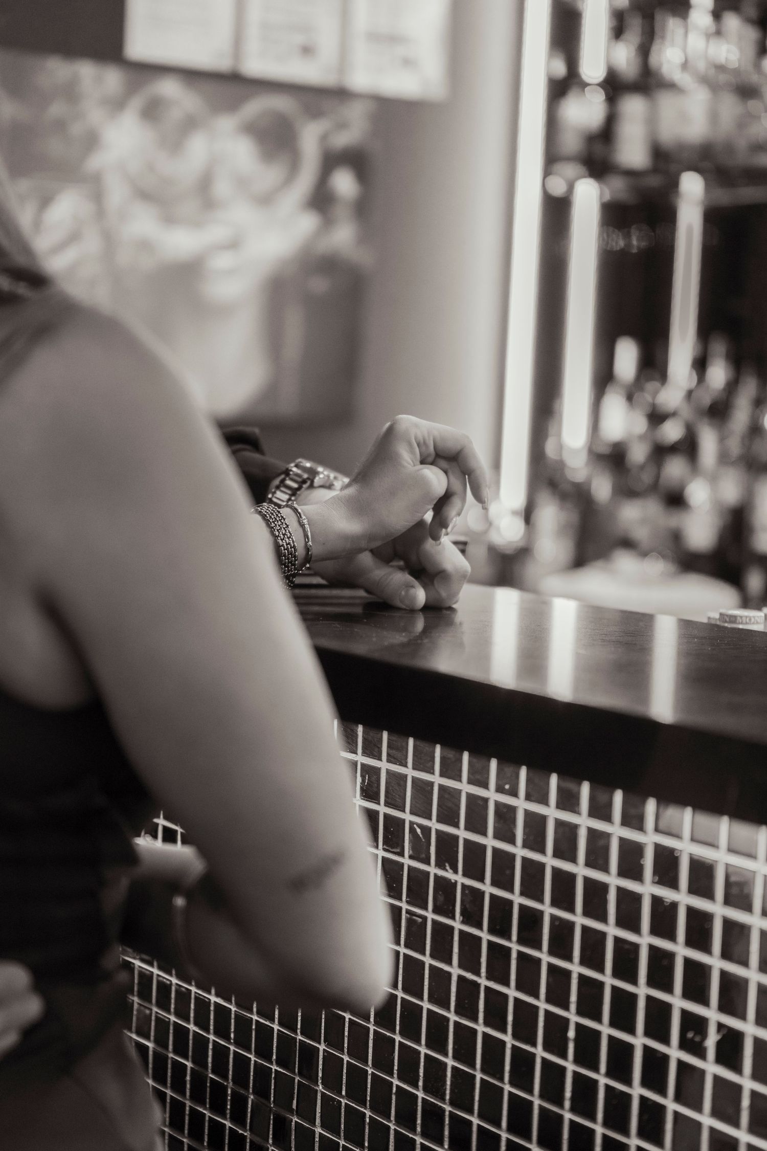 Intimate engagement portraits in a cosy Melbourne city bar.