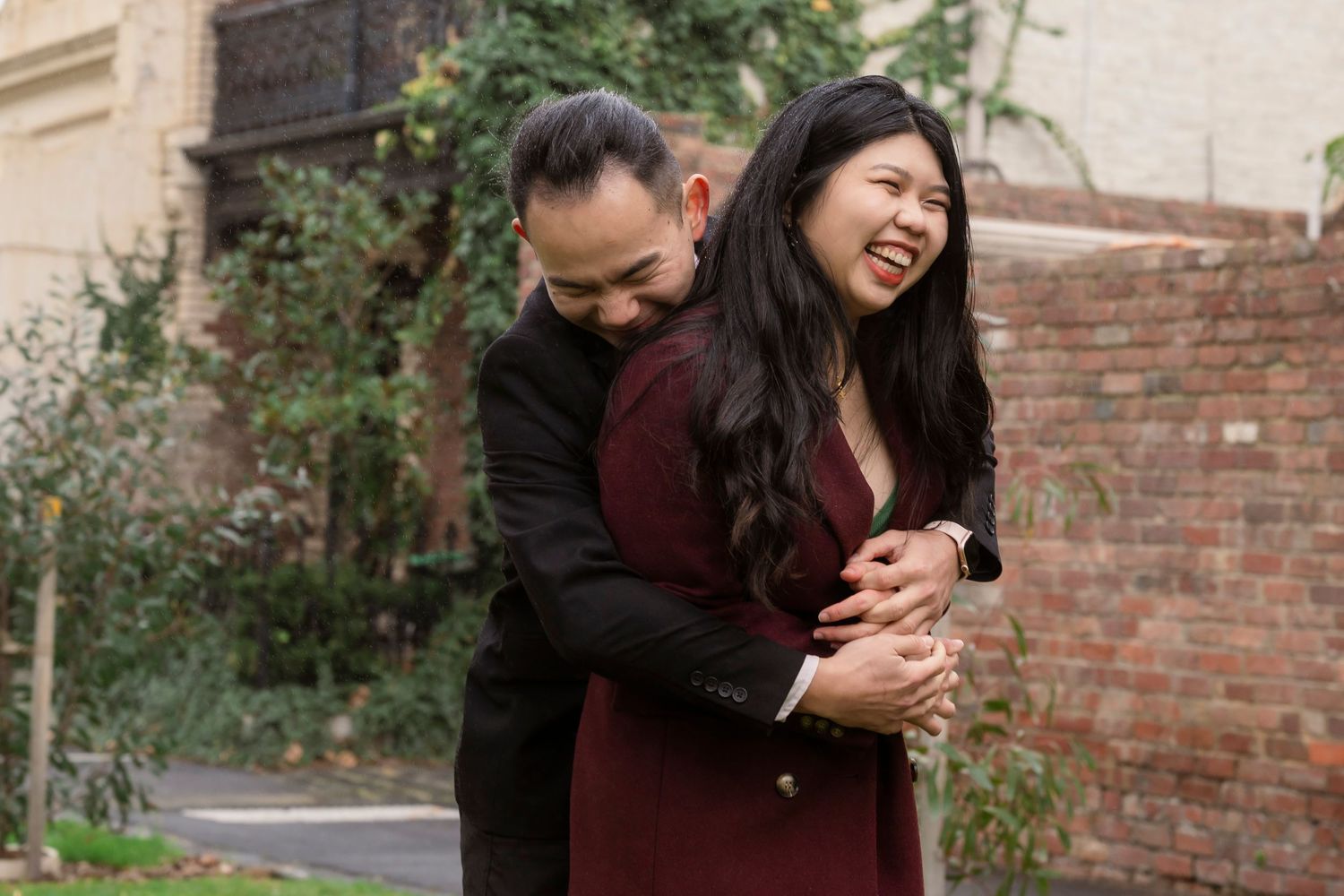 Couple wandering through the streets of Fitzroy during their Melbourne engagement session.