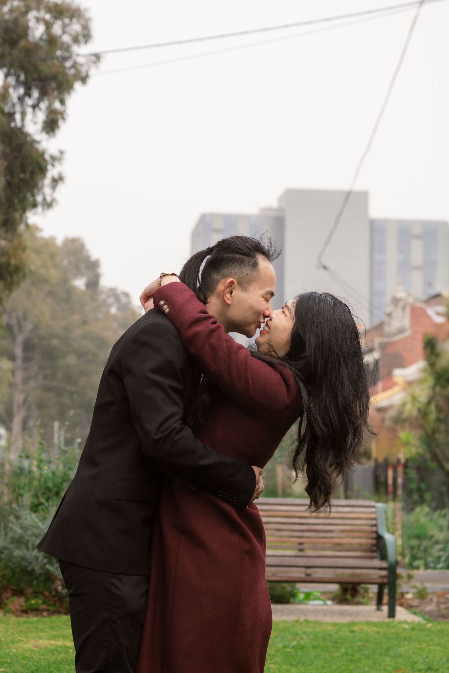 Couple wandering through the streets of Fitzroy during their Melbourne engagement session.