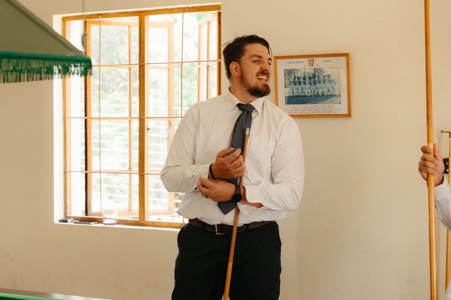 Groomsmen enjoy a game of pool at Steynshoop Valley Lodge