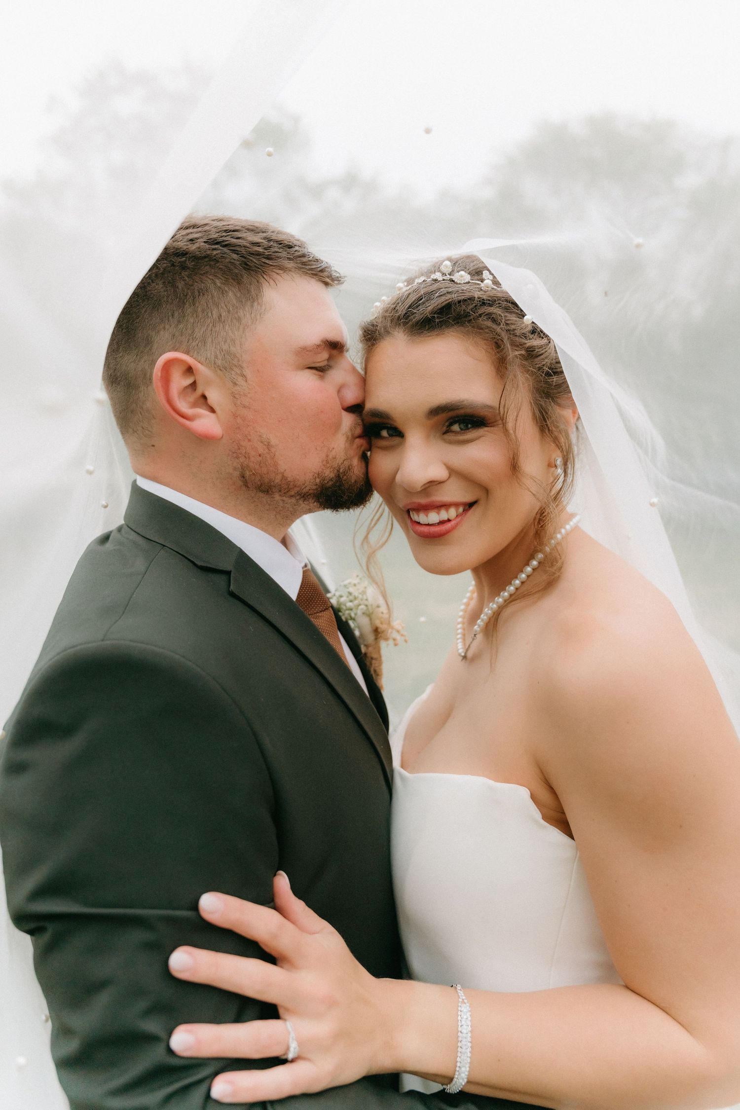 Close-up romantic wedding portraits showing tender moments between the newlyweds.