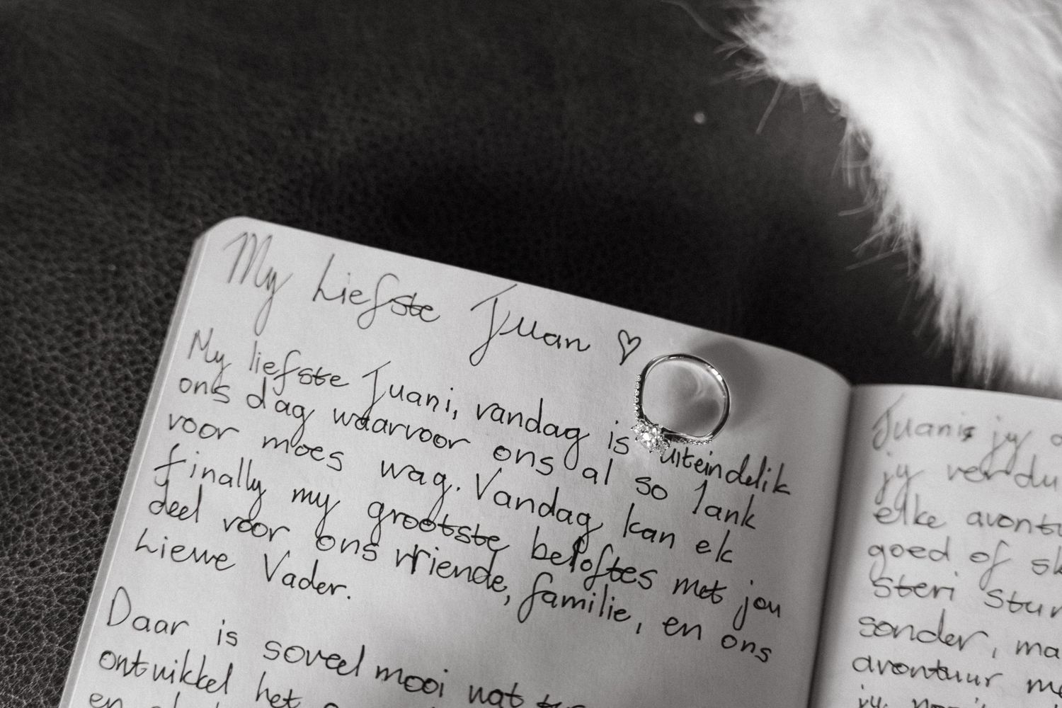 Handwritten wedding vows or letters shown in black and white on notebook paper.