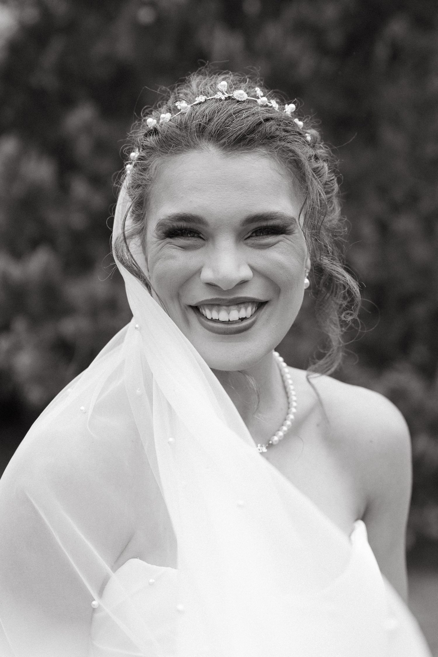 Black and white close-up portrait shots showing joyful expressions.