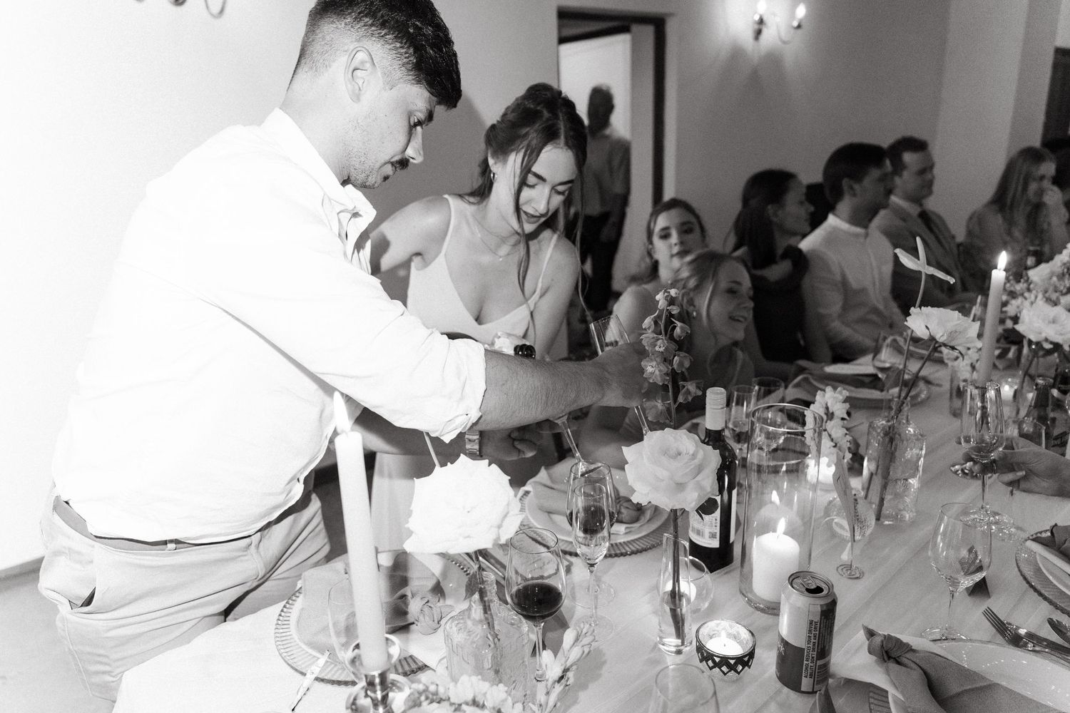 Black and white photo strip showing a sequence of candid moments at what appears to be a dinner party or gathering.