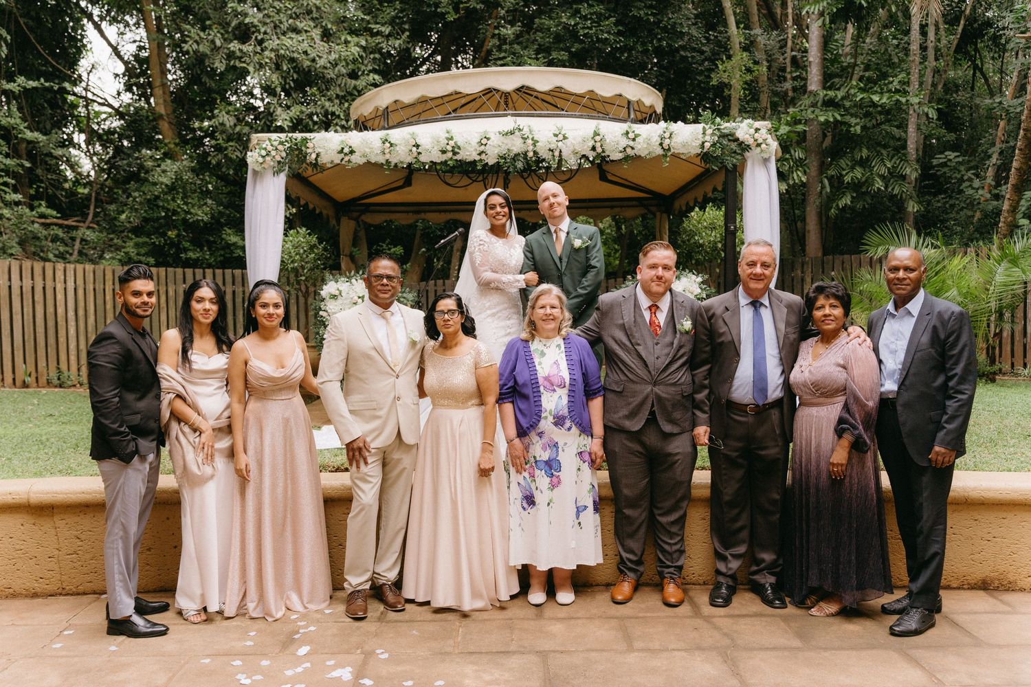 Wedding party poses together in a modern collage format with blush and neutral tones at an outdoor venue.
