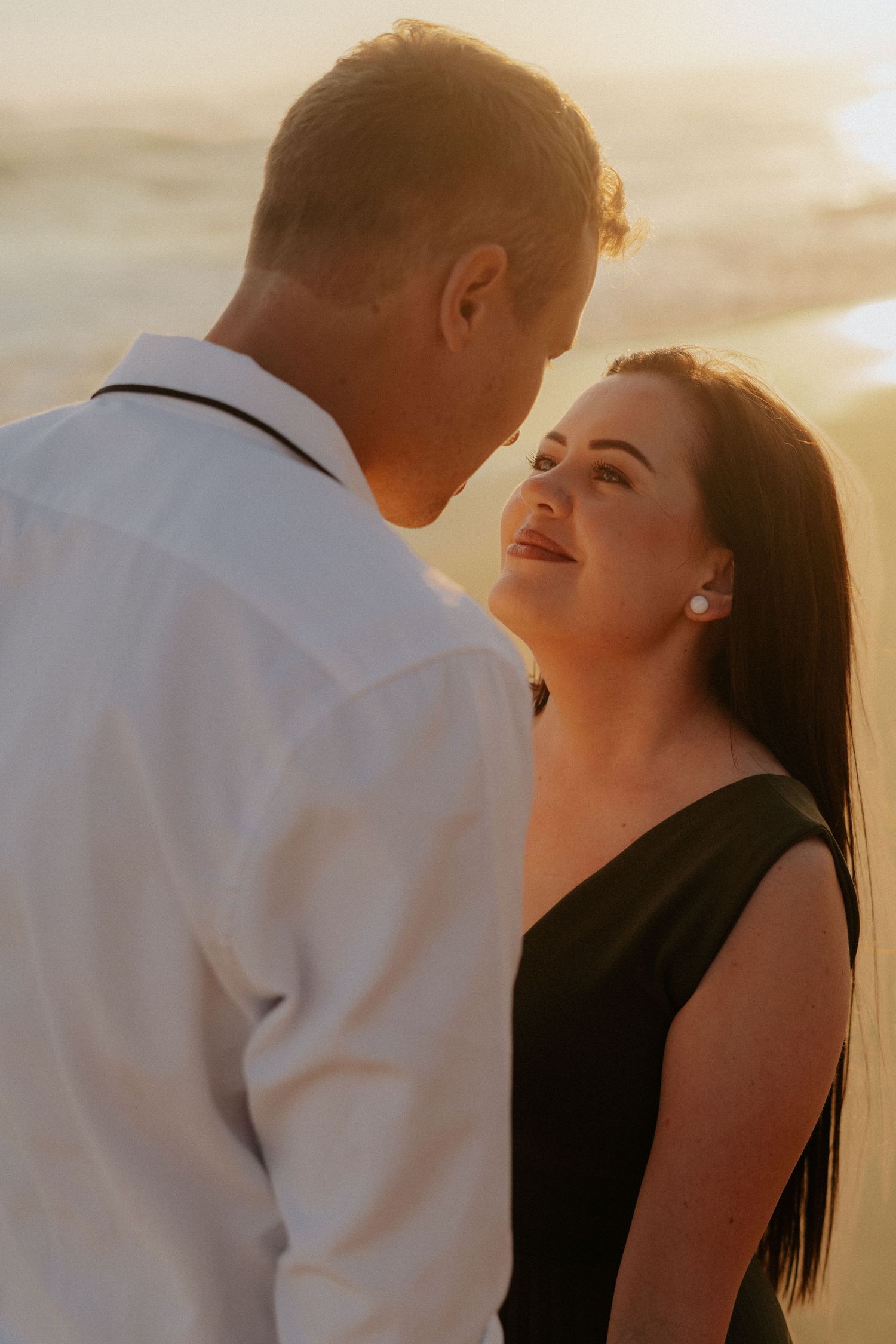 A couple shares an intimate moment at sunset during their Garden Route Photo Shoot