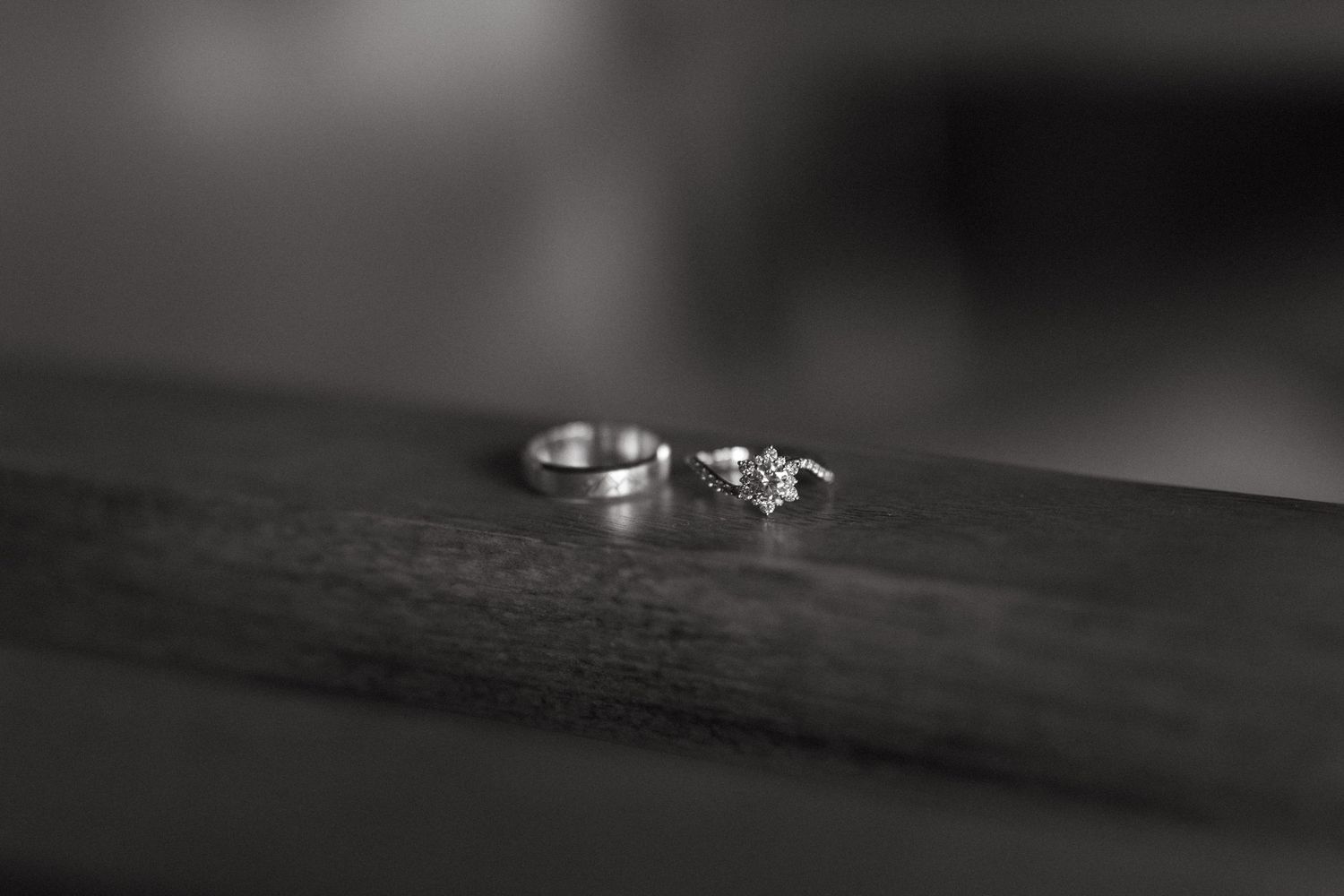 Close-up macro shot of wedding rings with artistic blur effect.