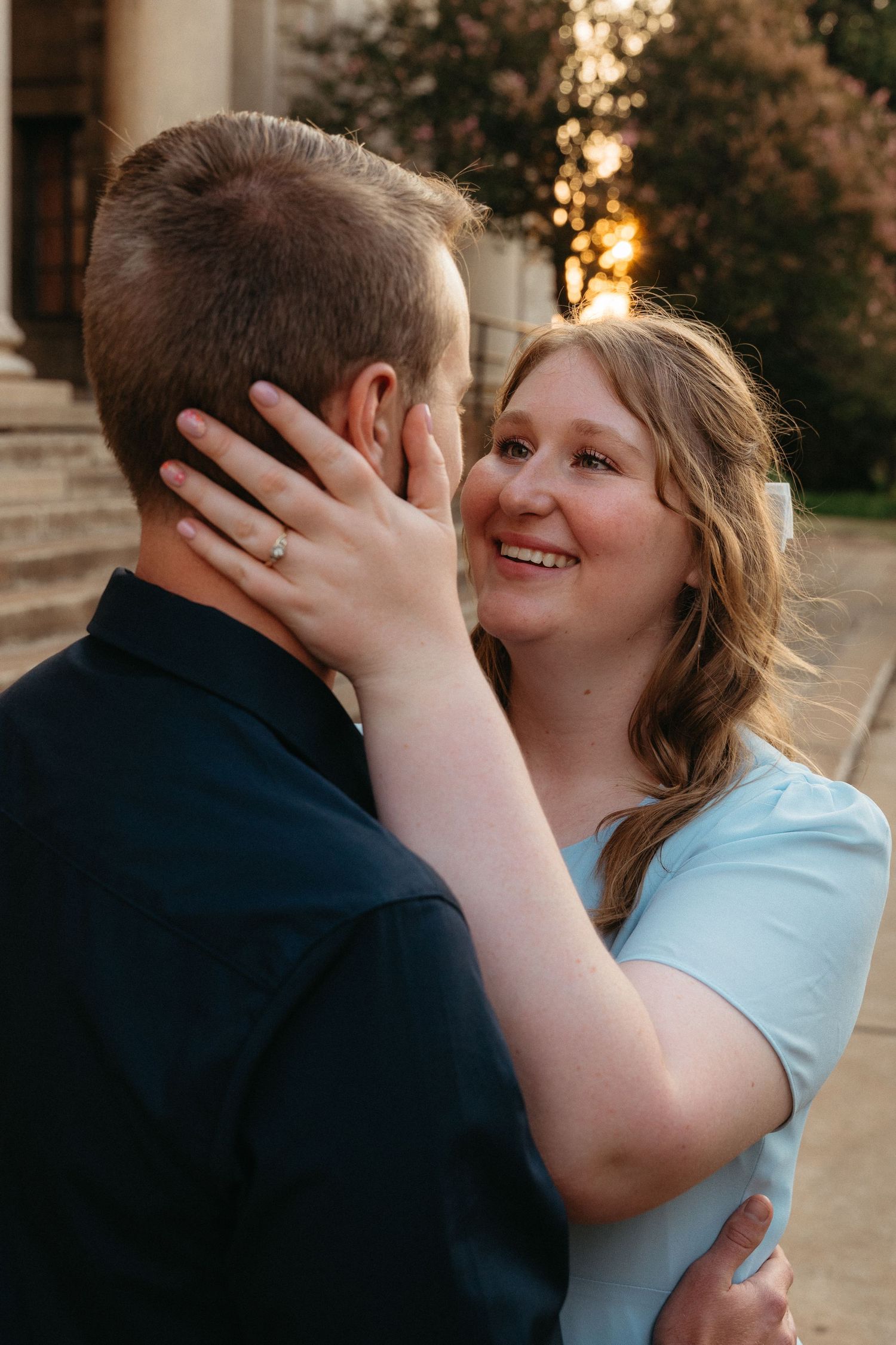 A romantic couple shares tender moments in a series of intimate outdoor portraits at sunset.
