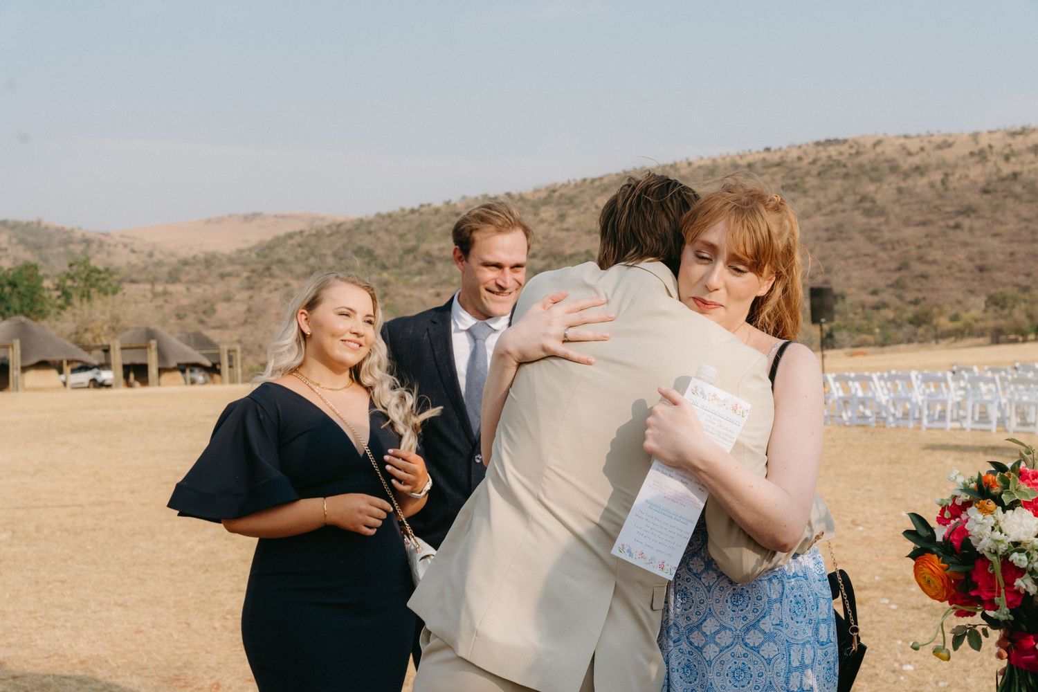 Wedding celebration candid moments captured outdoors in natural lighting.