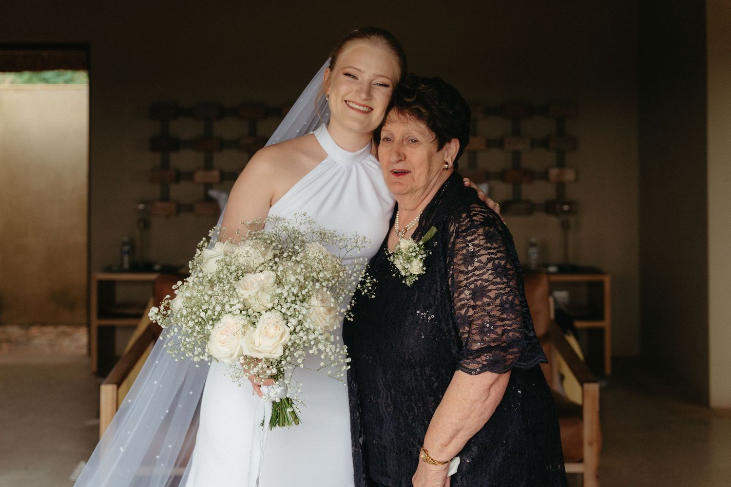Wedding celebration moment captured in an indoor venue with elegant decor and lighting.