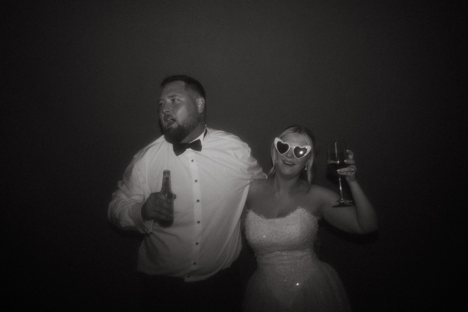 People dancing and having fun at a dimly lit party or celebration.
