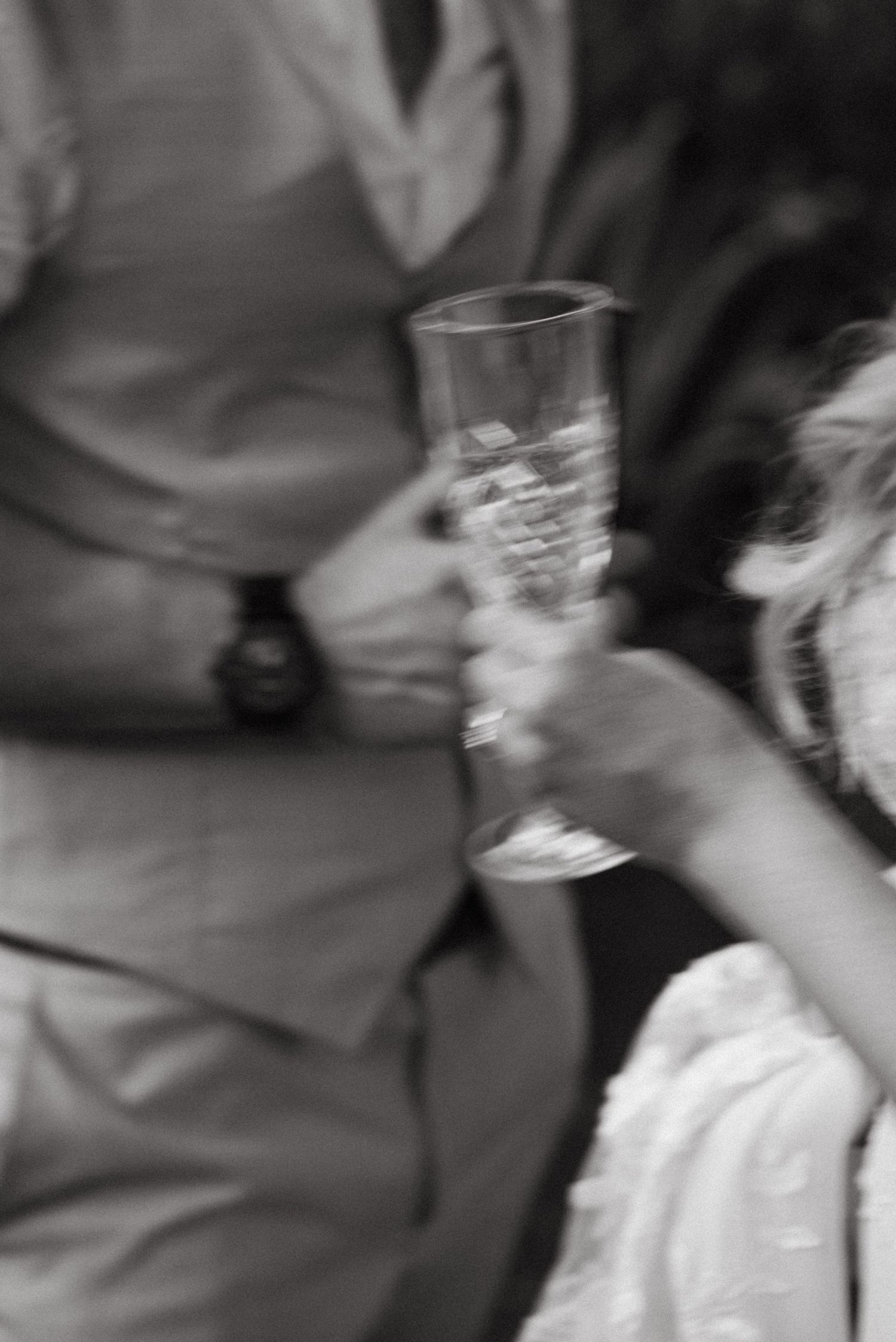Blurred motion captures dancing and movement at a wedding celebration.