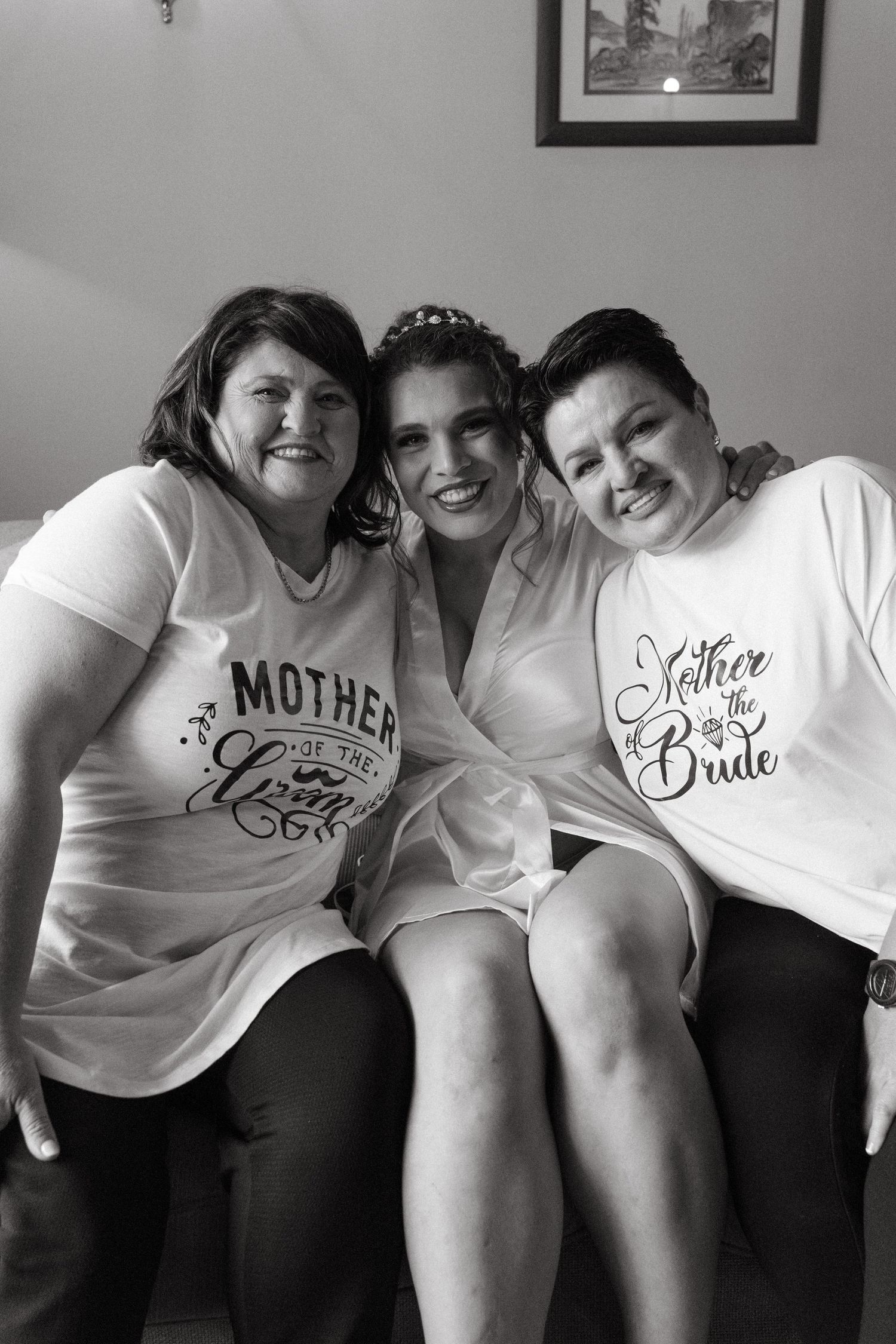 Group wearing matching white t-shirts with wedding-related text poses together for photos.