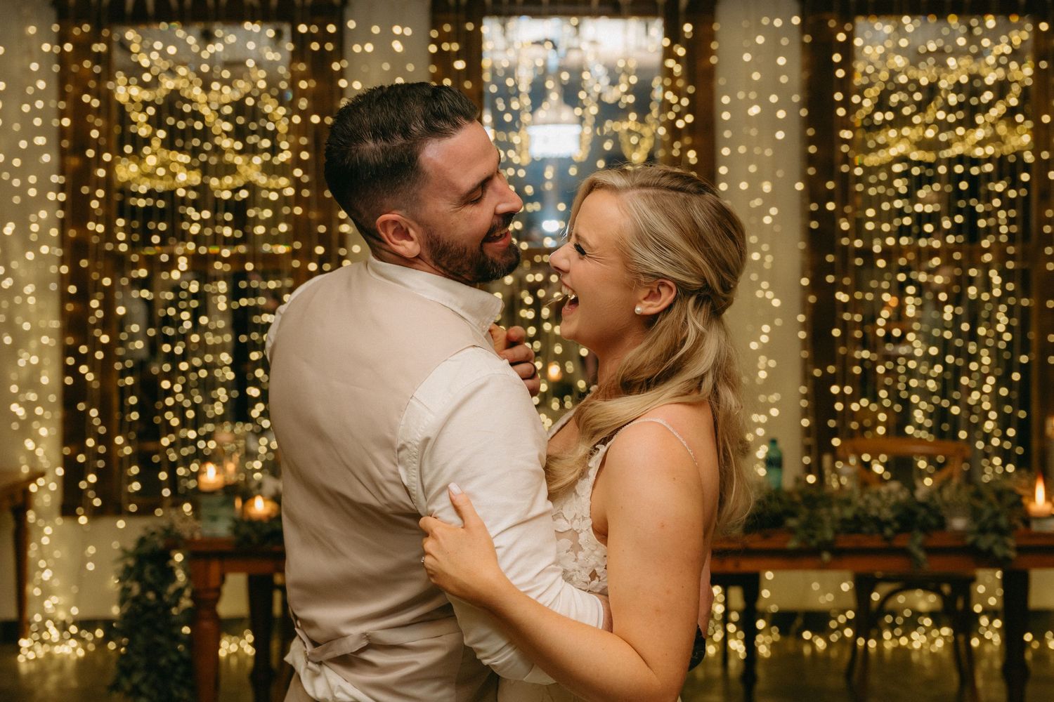 Romantic dance moments captured against a backdrop of golden fairy lights.