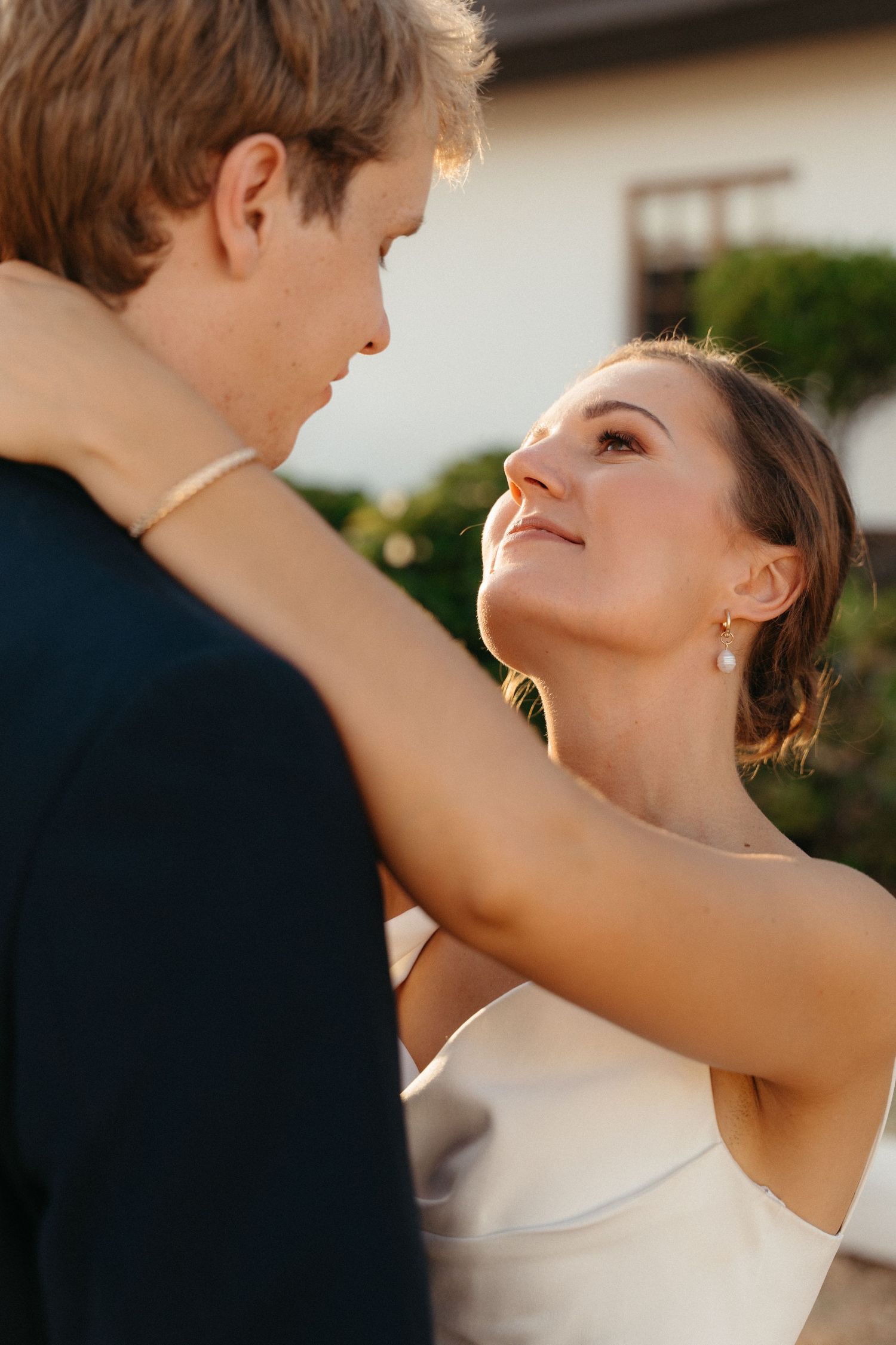 Romantic close-up sequence of a couple dancing together at their wedding celebration.