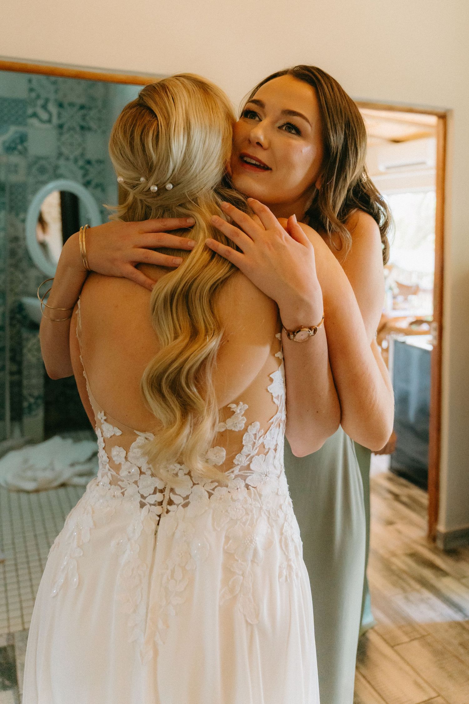 Close-up details of lace wedding dress with delicate floral appliques.